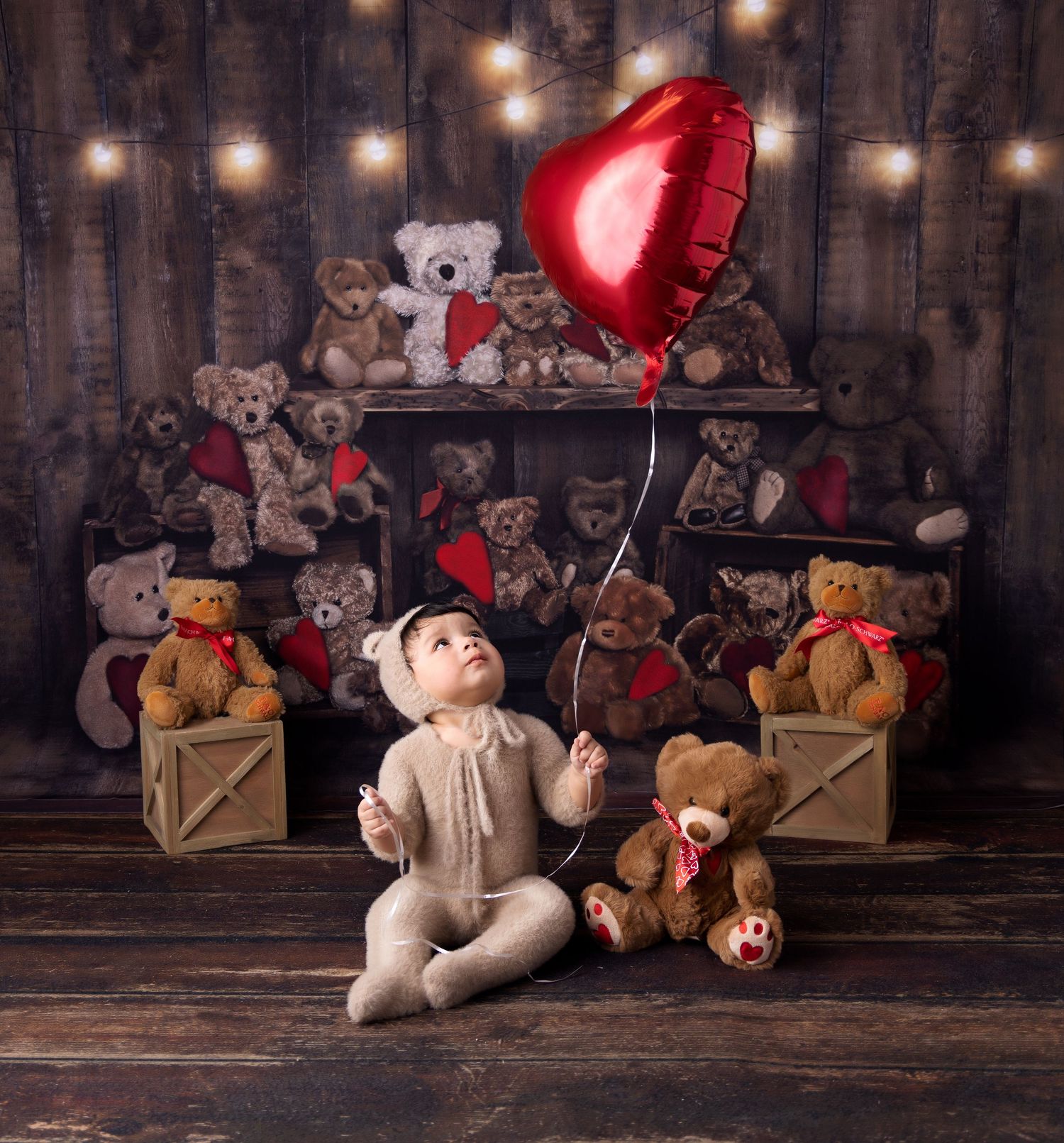String lights illuminate a rustic wooden backdrop with vintage teddy bears and Christmas decorations arranged below.
