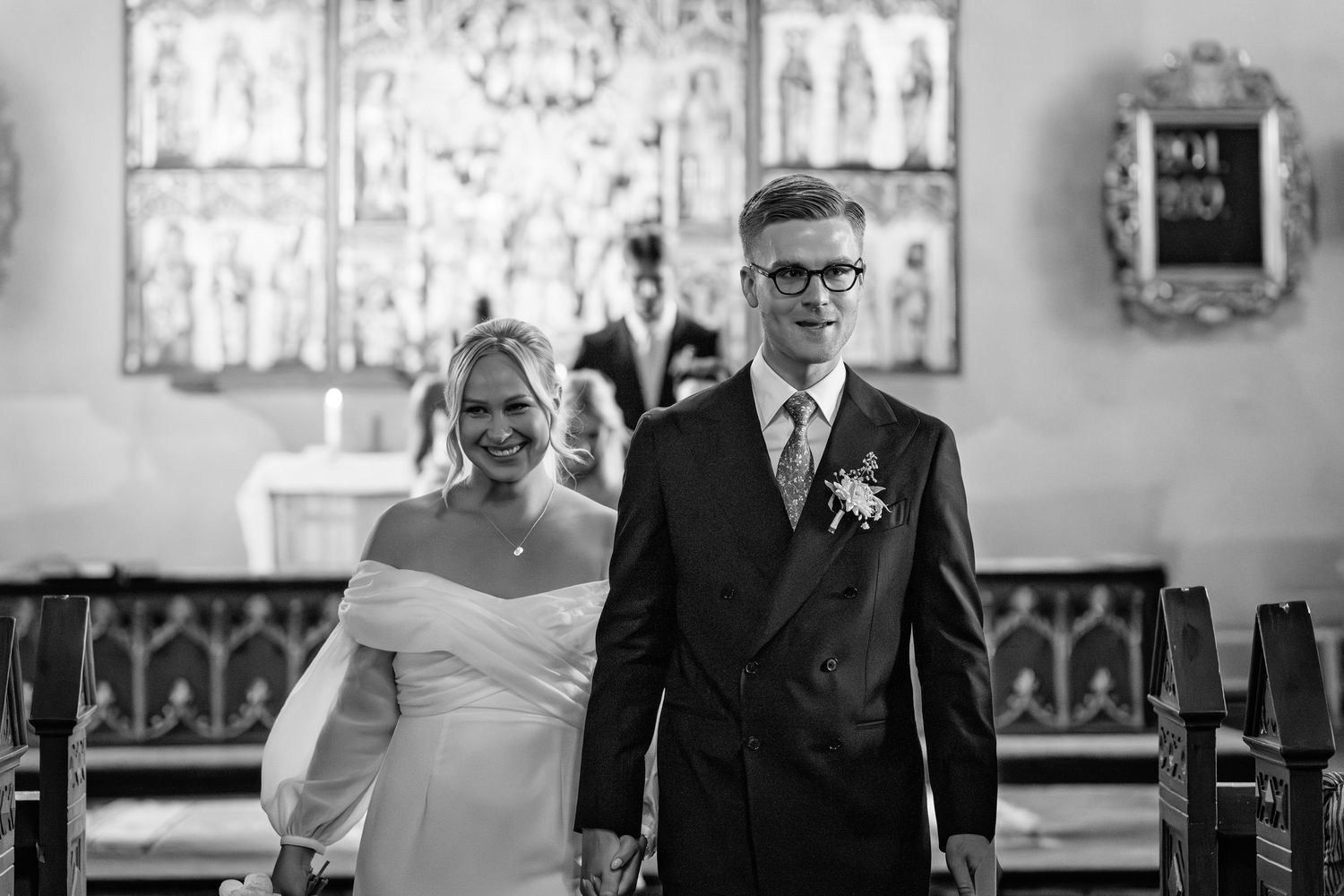 A black and white wedding photo collage showing joyful moments between couples in formal attire at a church ceremony.