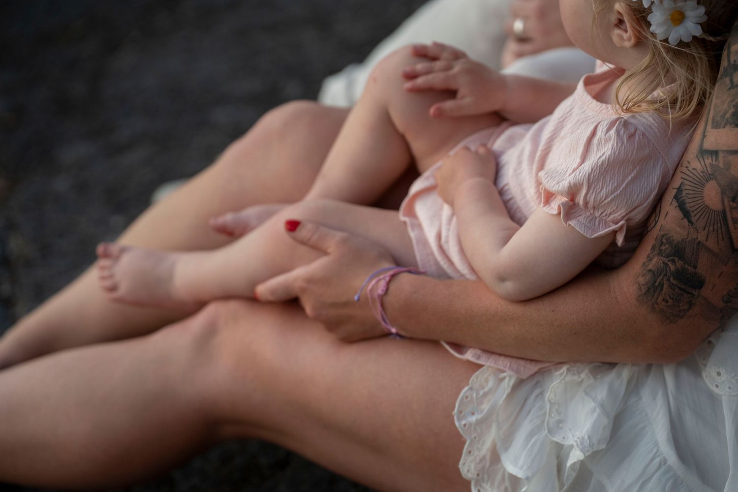 A series of intimate family moments captured in soft focus along a wooded path.