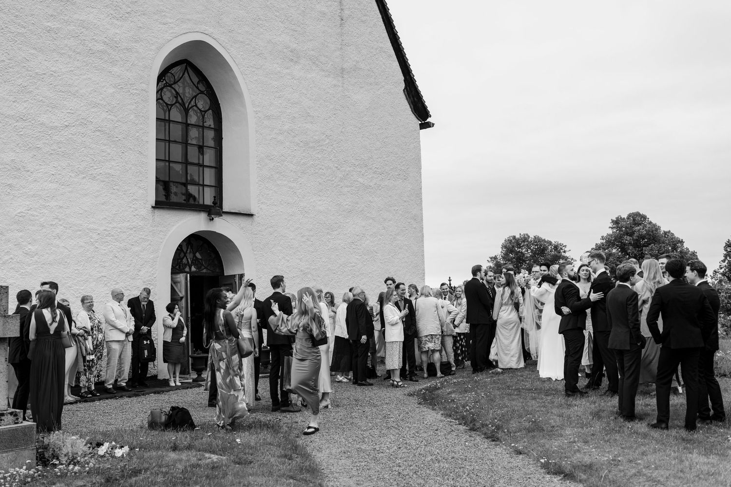 A black and white photo series showing people gathering outside a church building in a vintage setting.