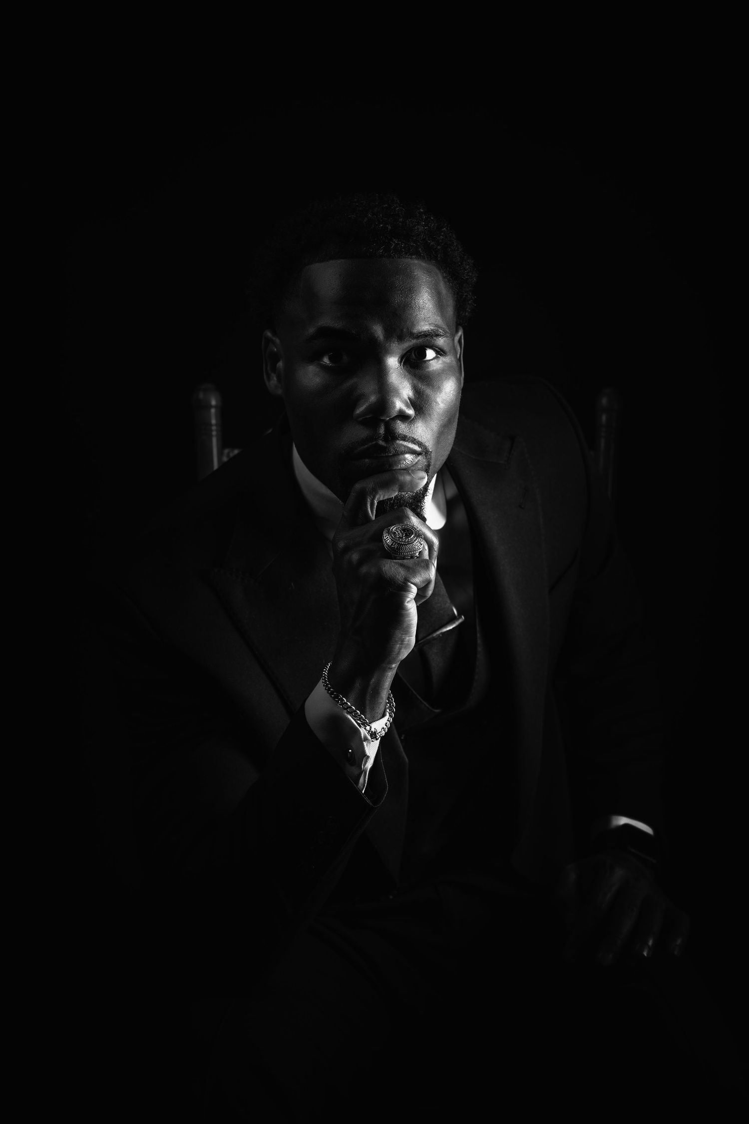 Dramatic black and white portrait series showing a person smoking in dark shadows with moody lighting.