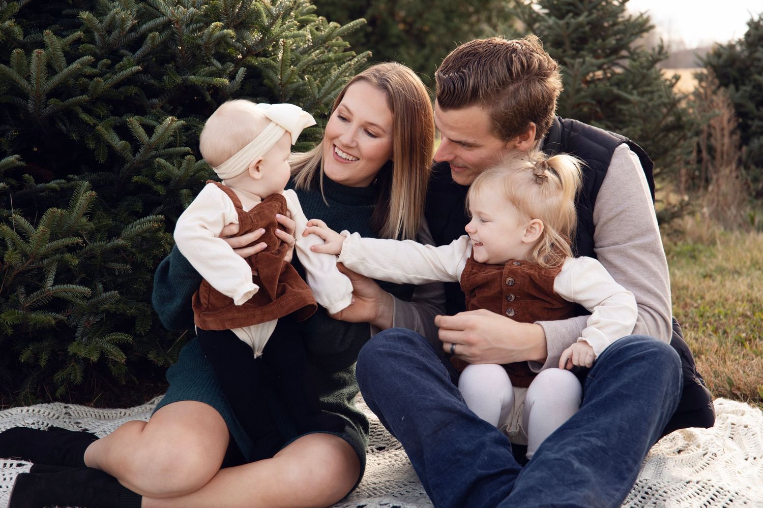 Candid family moments captured during an outdoor photo session.