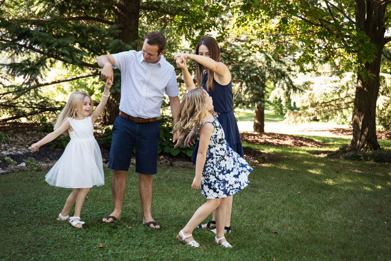 Candid moments of family members playing and interacting on a wooden deck.
