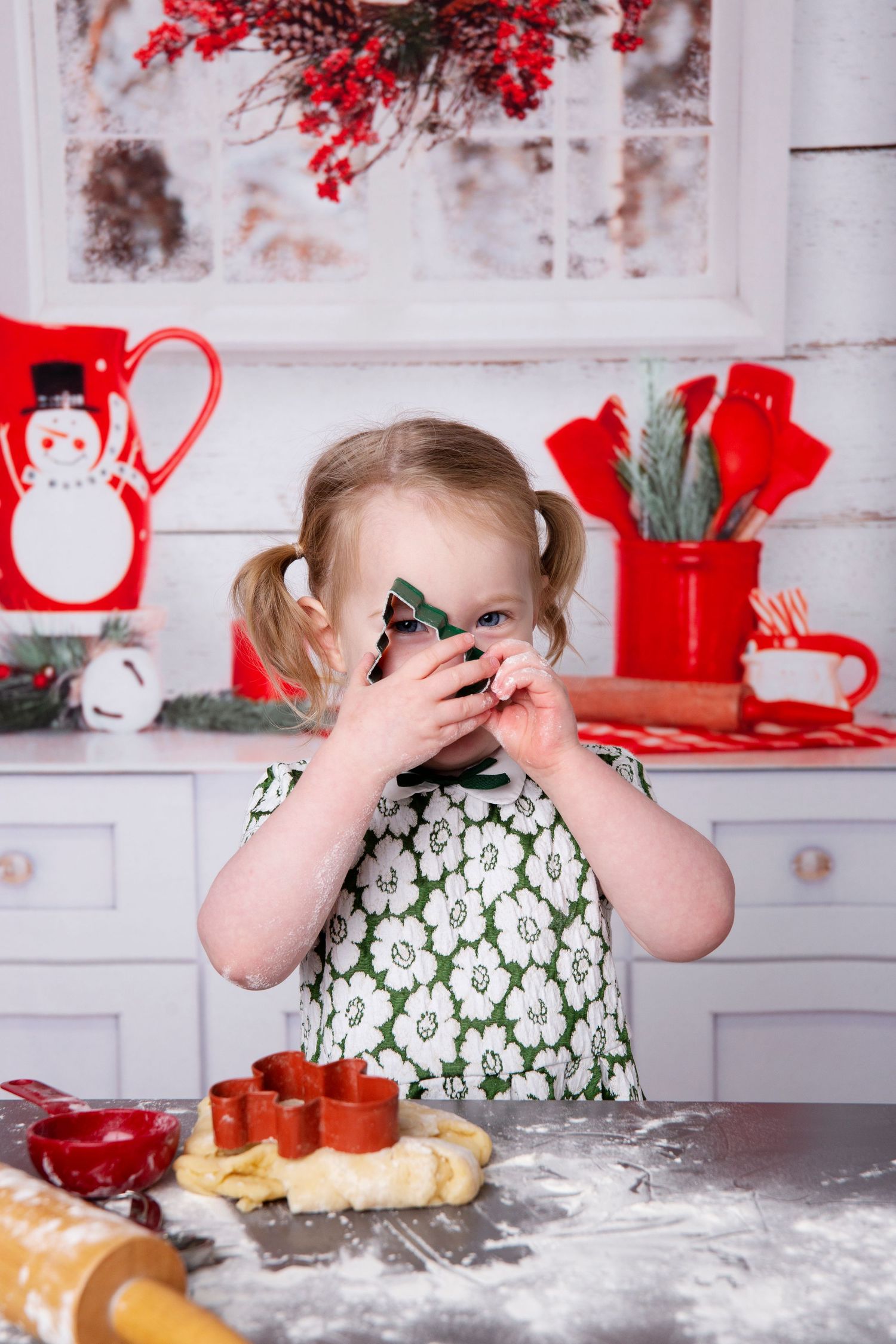 Four sequential photos show a messy baking scene with flour scattered on a white counter and red decor in background.
