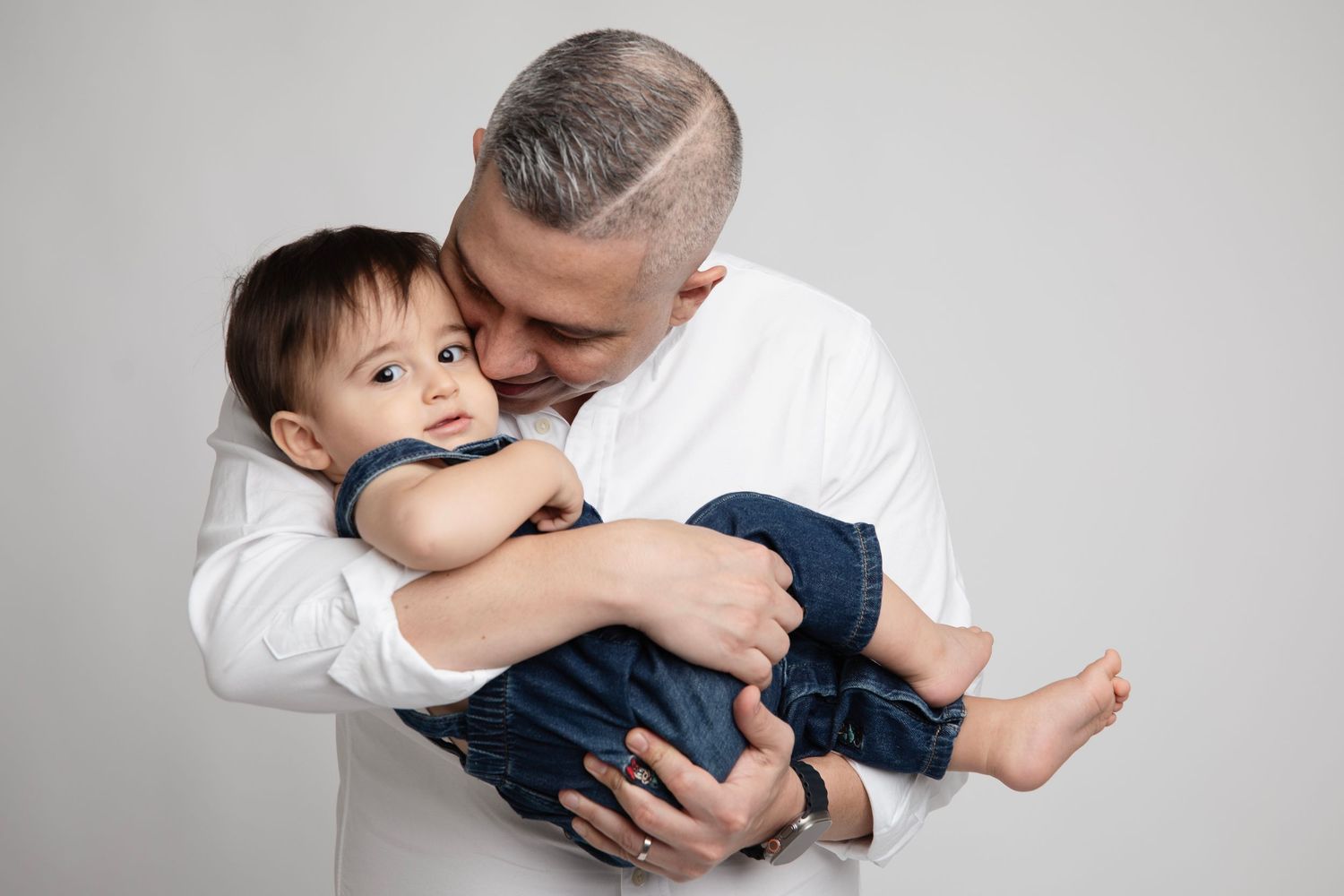 A tender moment captured in black and white as a parent and child share a loving embrace.