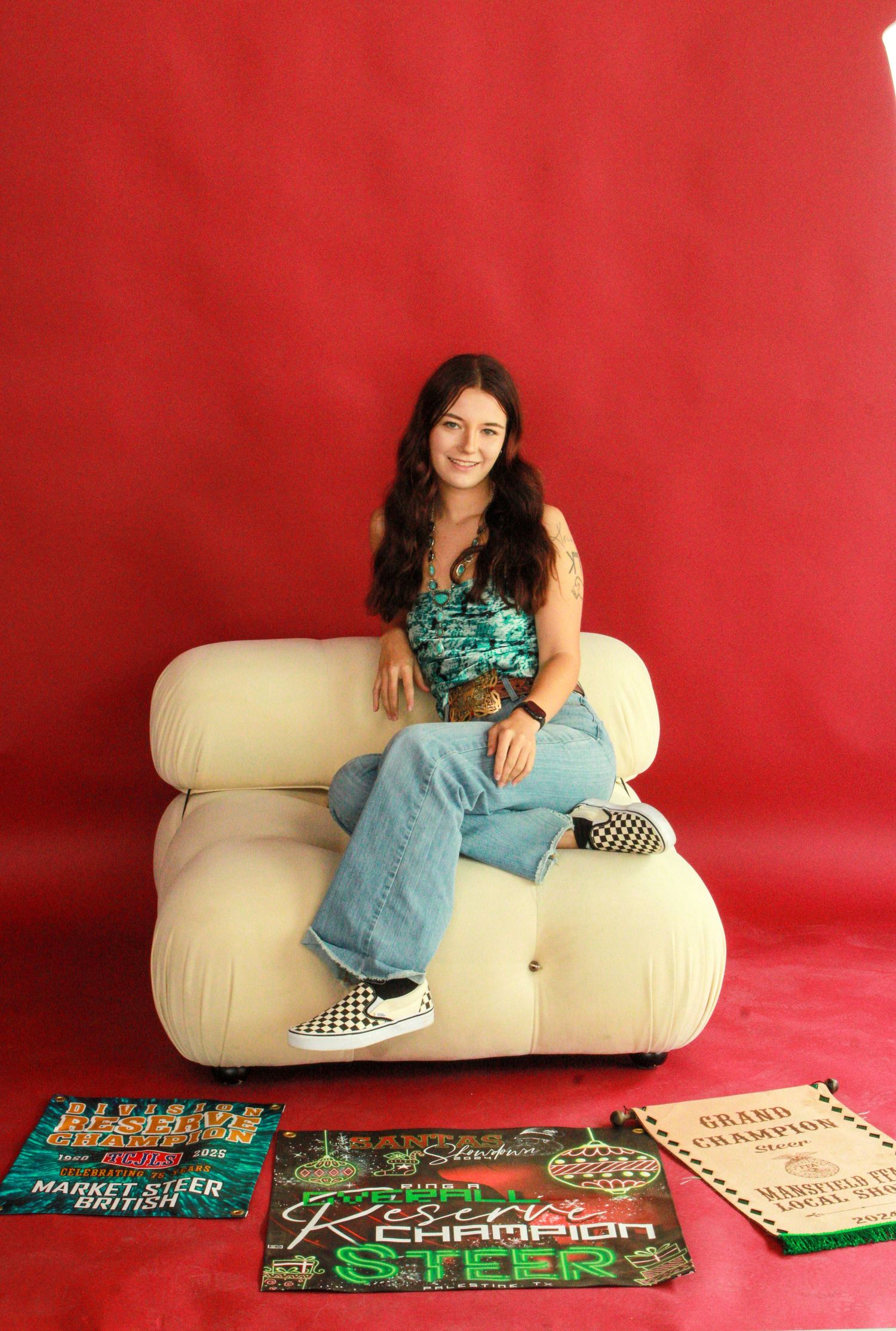 A sequence showing someone lounging on a beige sofa against a red backdrop with colorful skateboard decks displayed below.