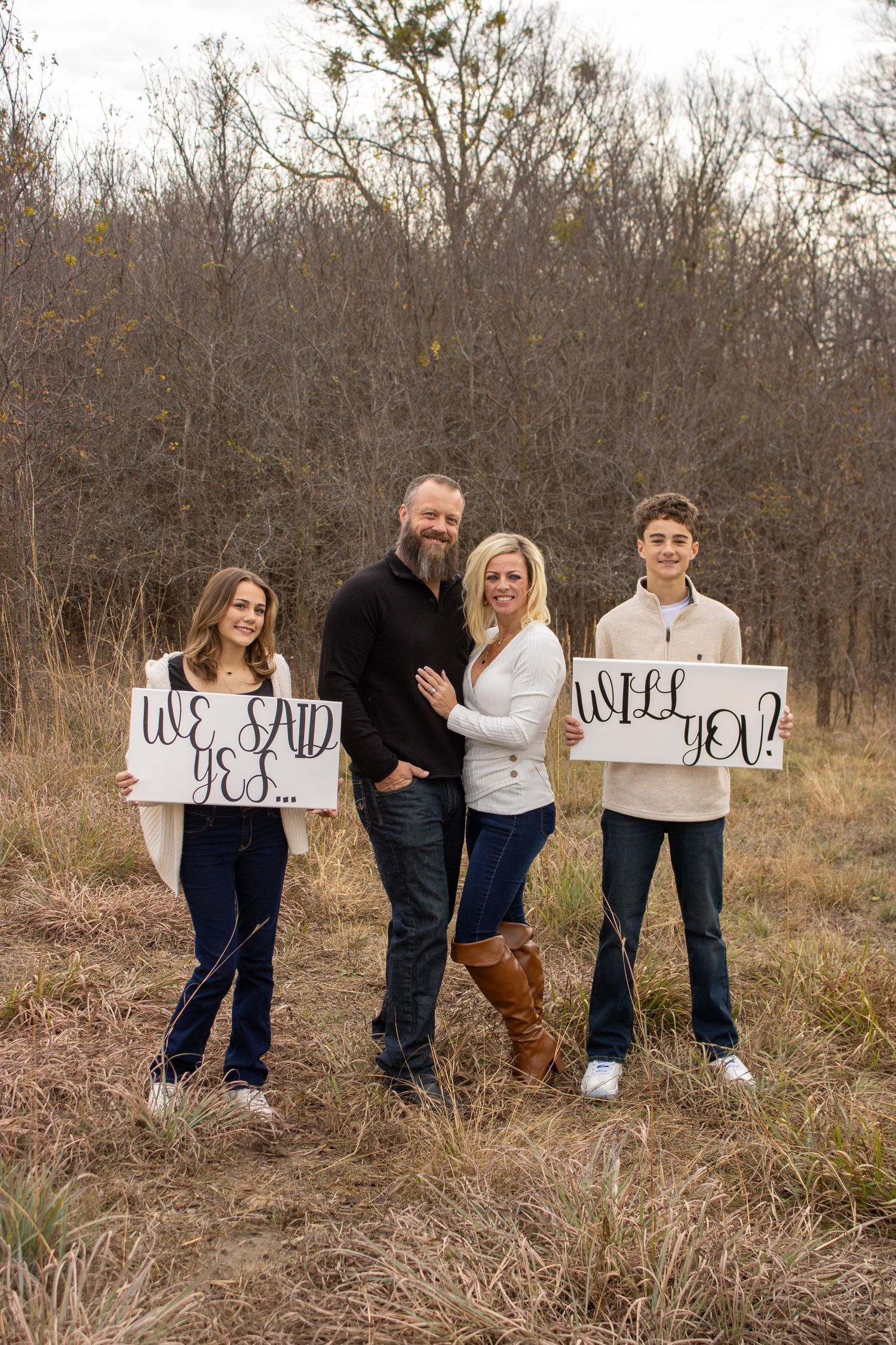 A creative outdoor photo series showing signs spelling out 'Will you marry me?' in a fall field setting.