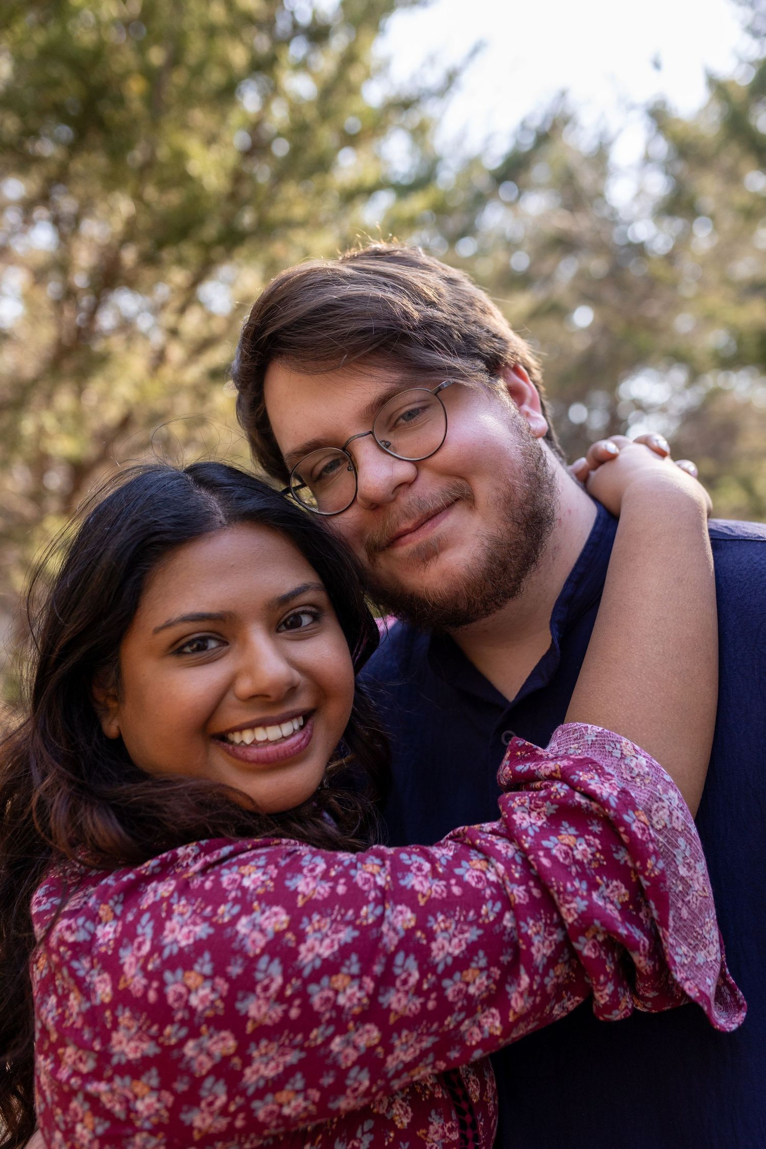 A couple shares an intimate moment outdoors in a series of candid photos showing their affection and joy.