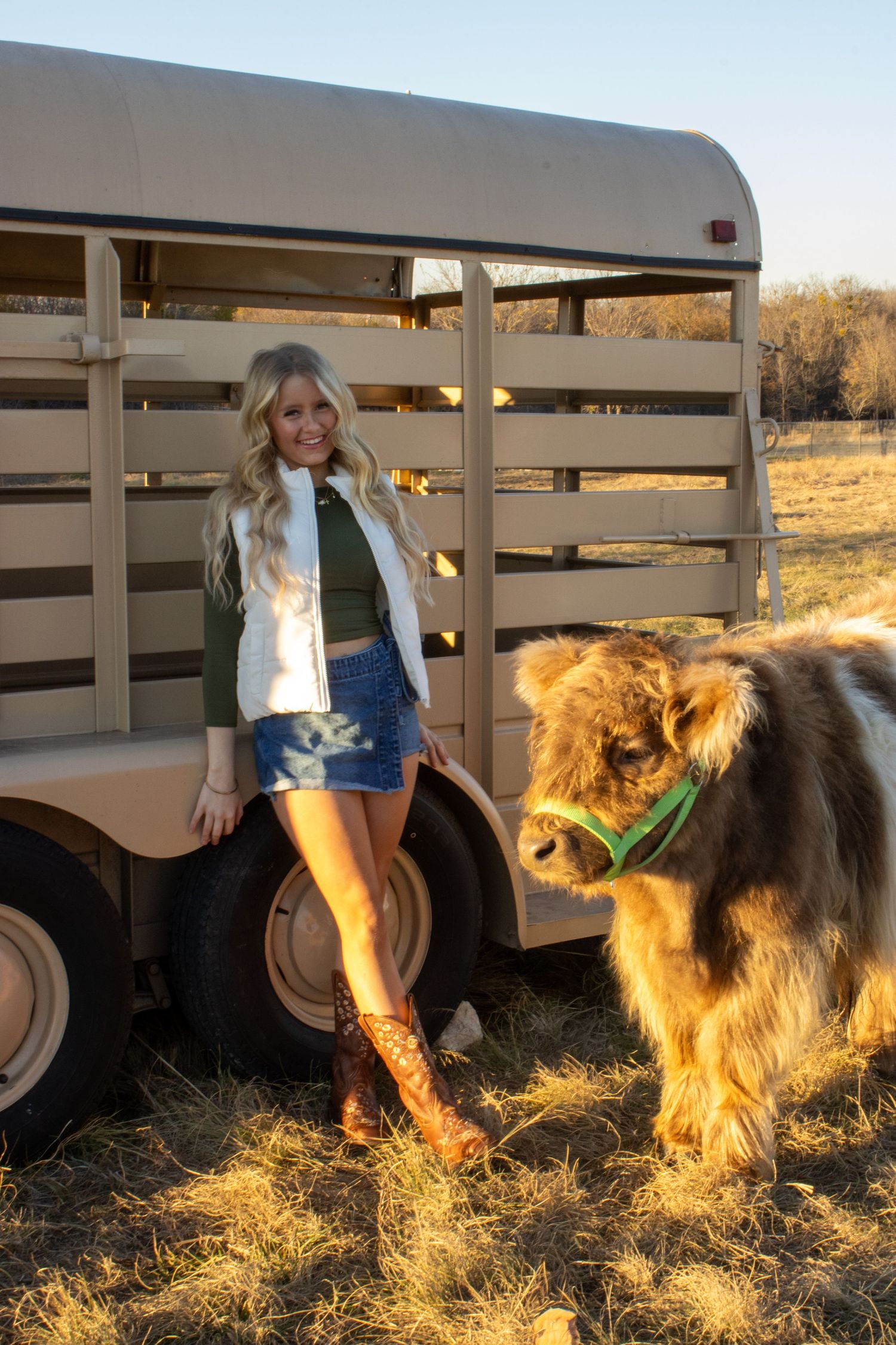 A sequence of images shows a person in a white jacket feeding hay to horses at sunset near a horse trailer.