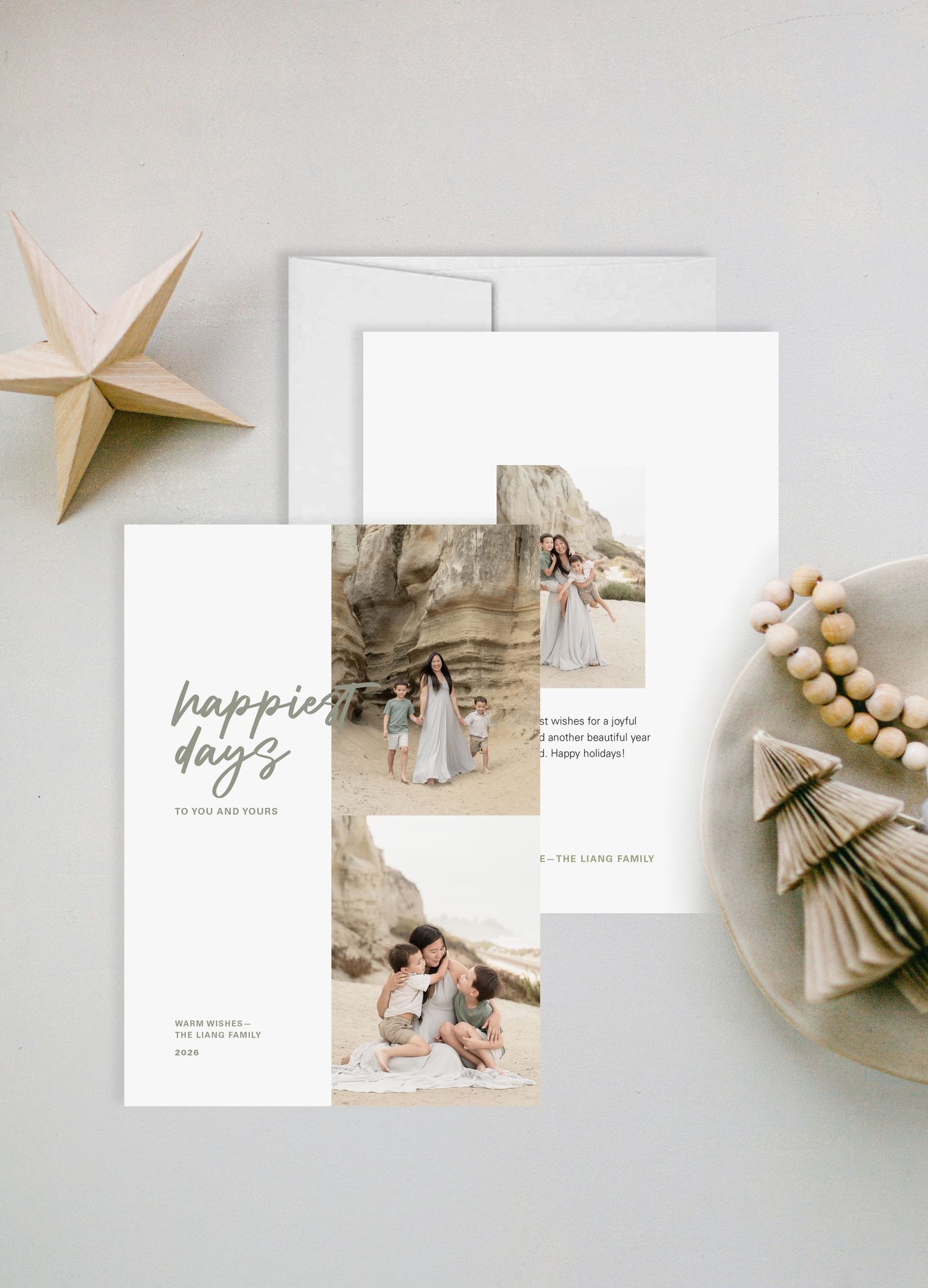 Elegant holiday greeting cards featuring family photos, script text reading happiest days, minimalist white design with gold star decor.