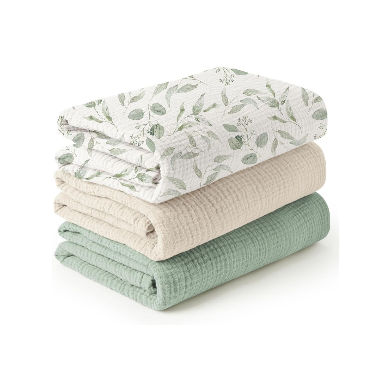Three folded muslin swaddle blankets in green botanical print, beige, and sage green.