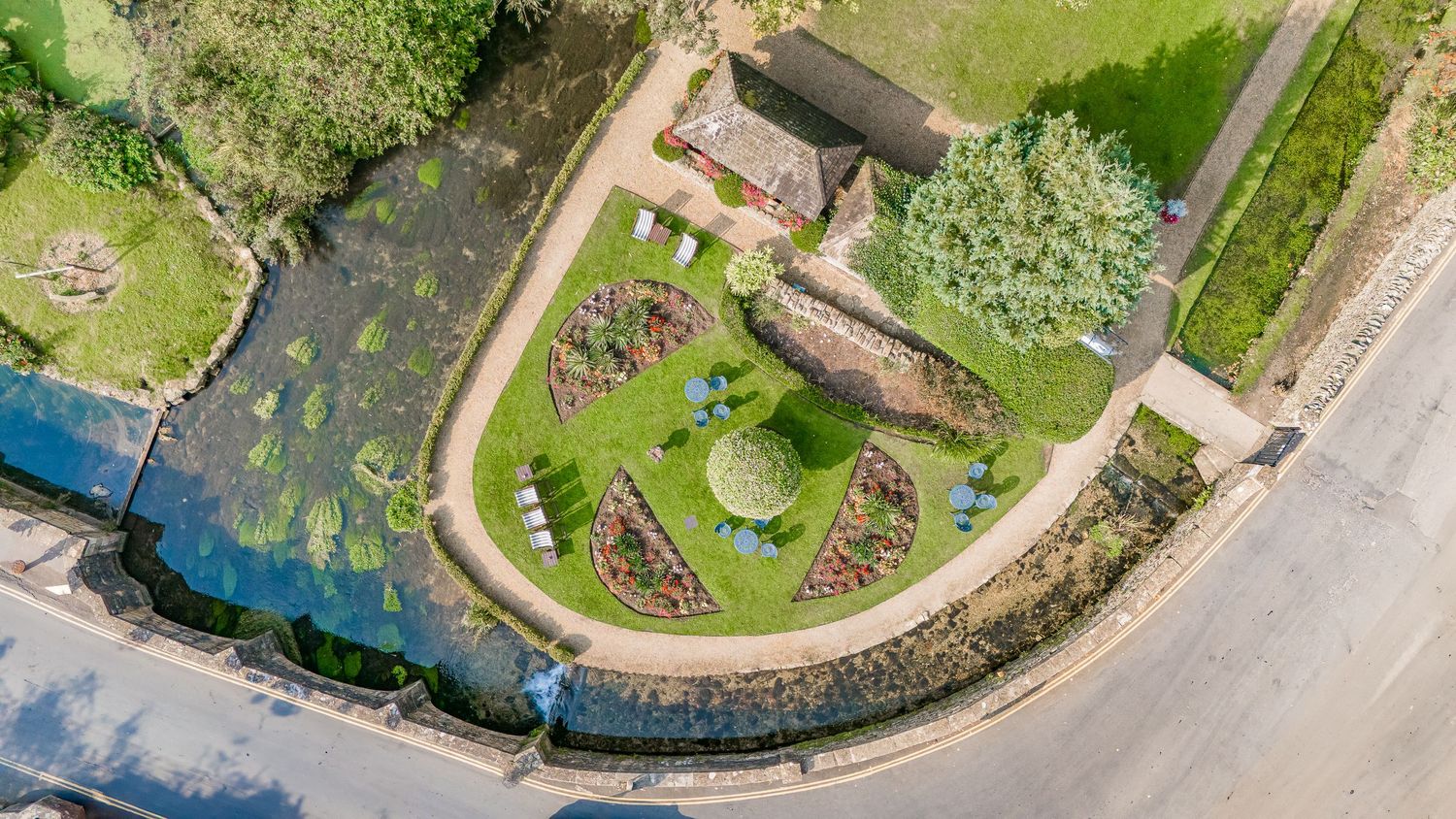 Drone aerial view of the wedding venue and guests, highlighting scenery and setting from above.