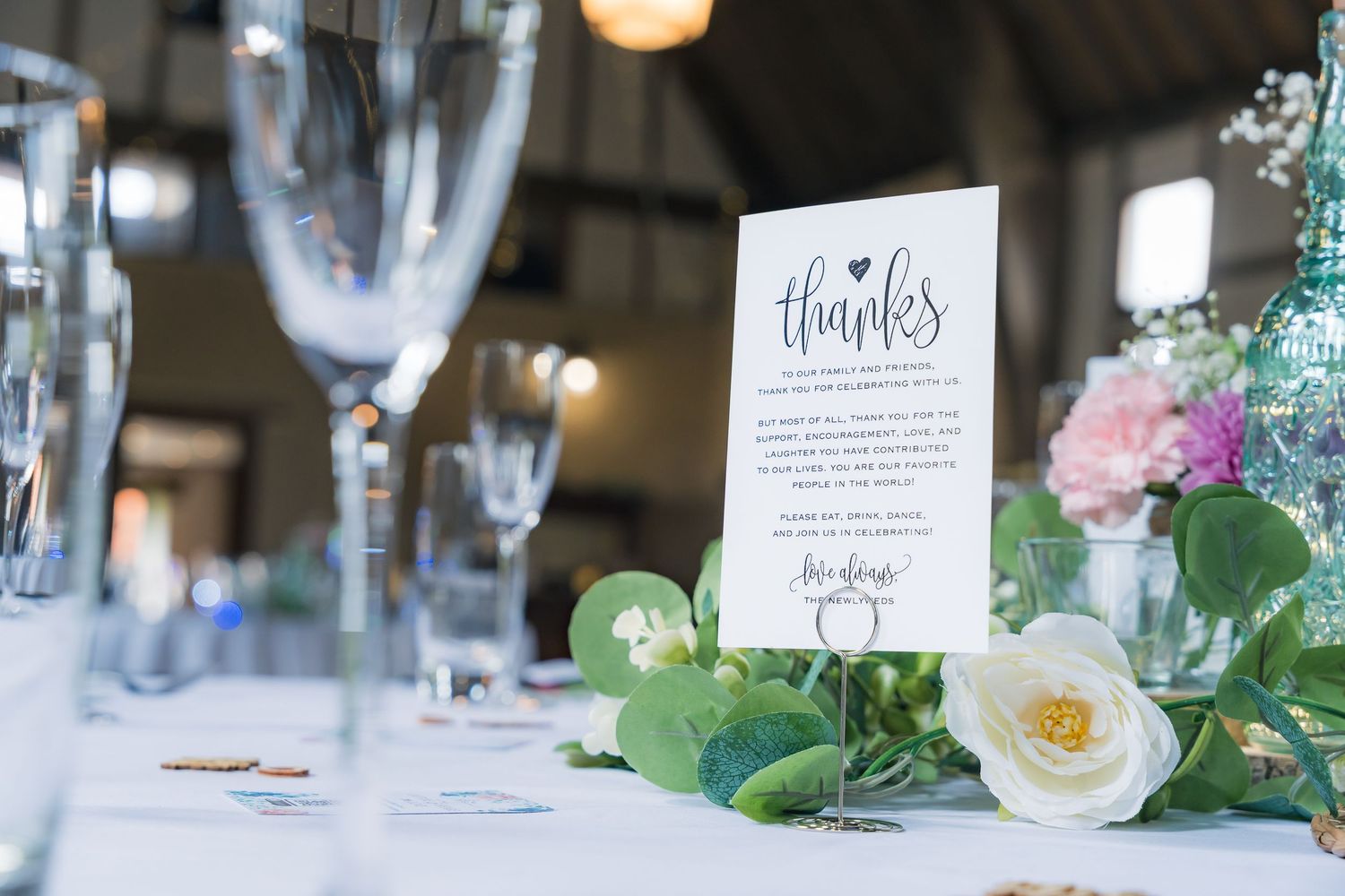 Close-up wedding details including rings, dress, flowers, and accessories, beautifully styled and lit.