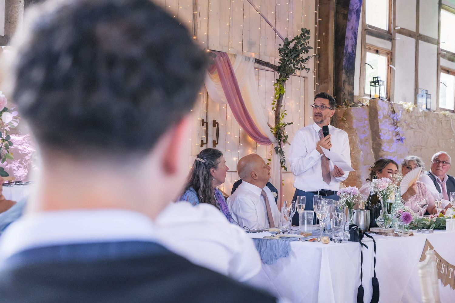 Heartfelt wedding speeches captured mid-reaction, full of laughter, tears, and candid emotion.