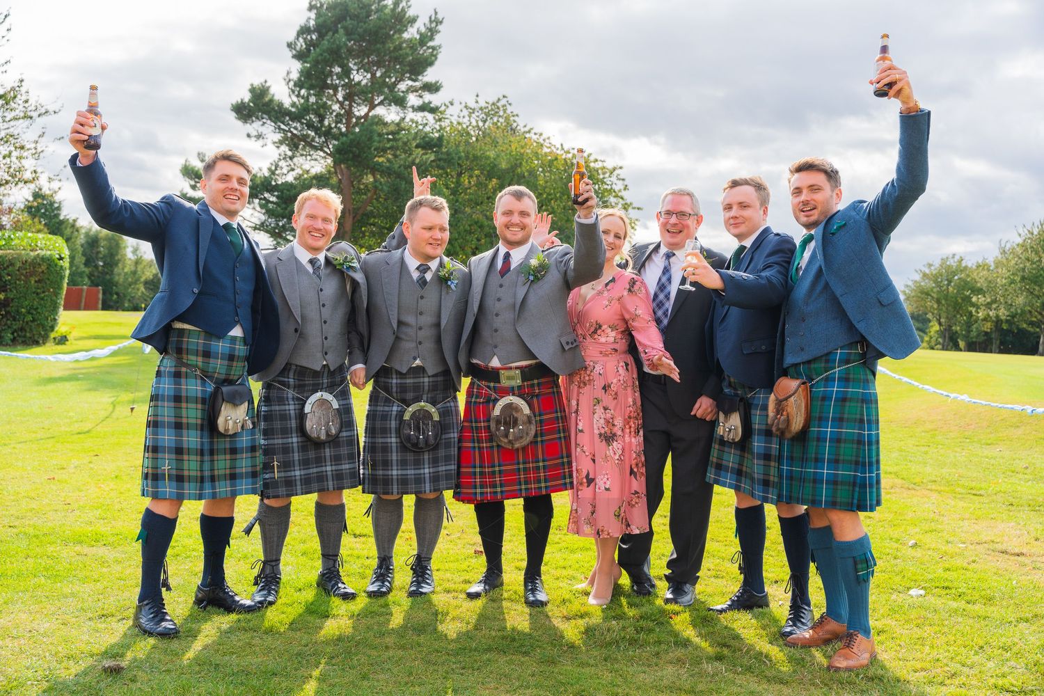Group wedding photo with family and friends, taken by R&S Oxfordshire Photographers in a candid, relaxed style.