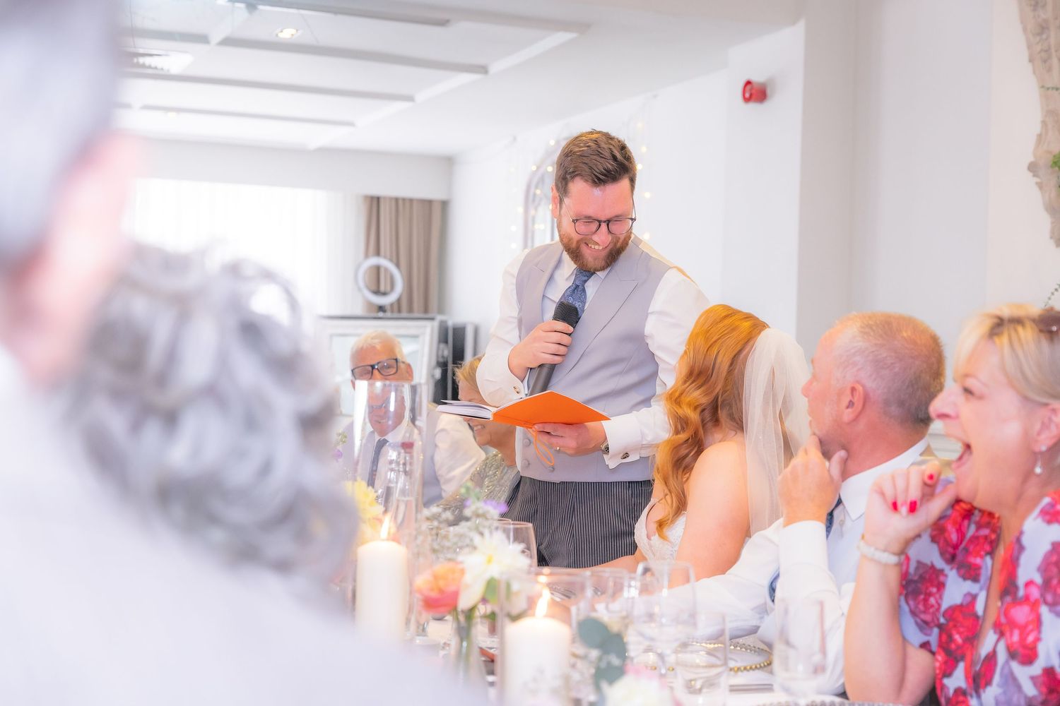 Heartfelt wedding speeches captured mid-reaction, full of laughter, tears, and candid emotion.