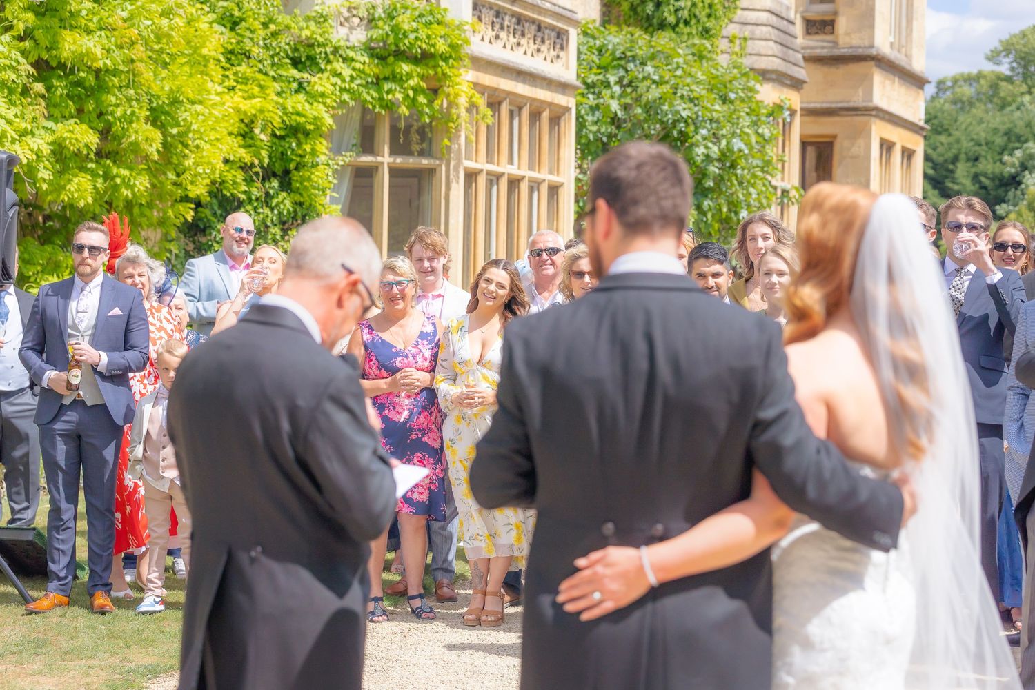 Candid shots of guests enjoying the wedding reception with laughter, toasts, and genuine moments.