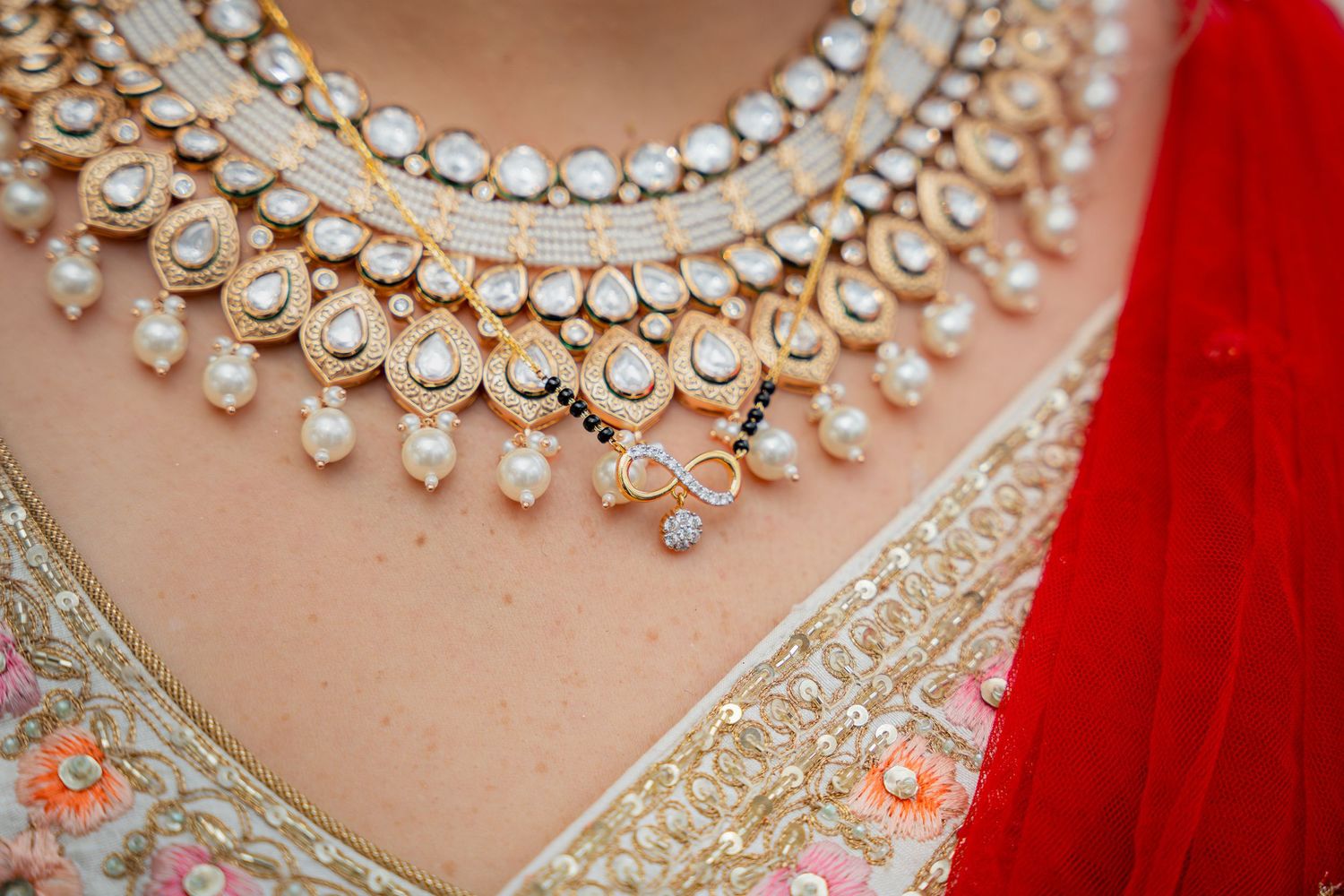 Close-up wedding details including rings, dress, flowers, and accessories, beautifully styled and lit.