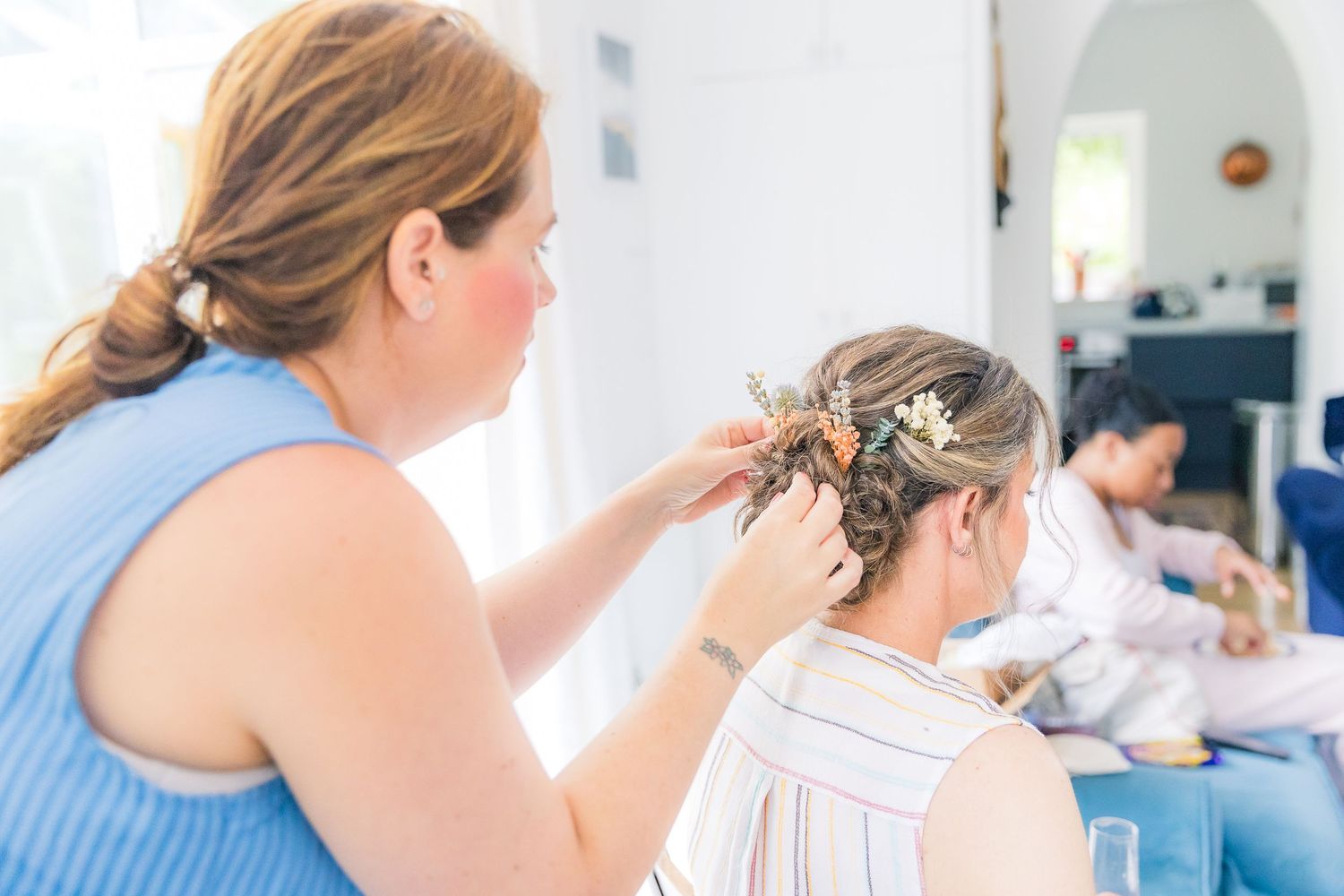 Candid bridal prep moments with soft light and emotion, captured naturally before the ceremony.