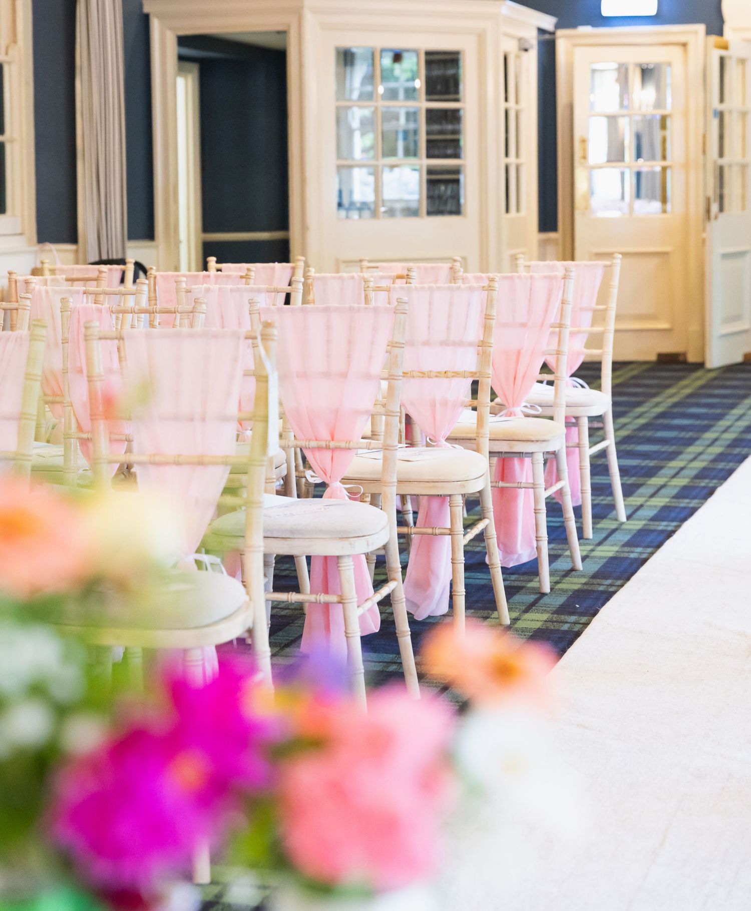 Close-up wedding details including rings, dress, flowers, and accessories, beautifully styled and lit.