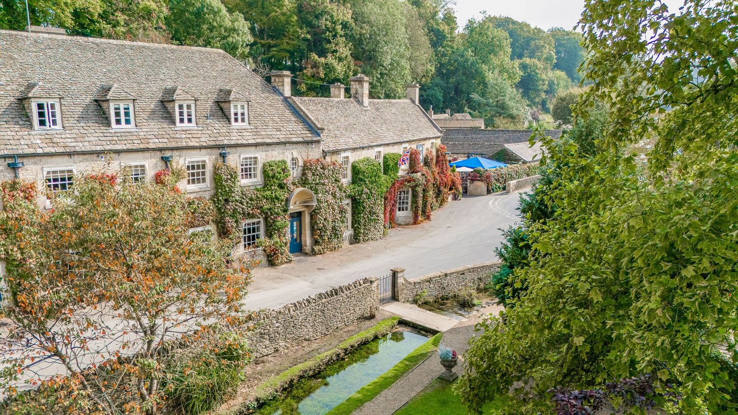 Drone aerial view of the wedding venue and guests, highlighting scenery and setting from above.