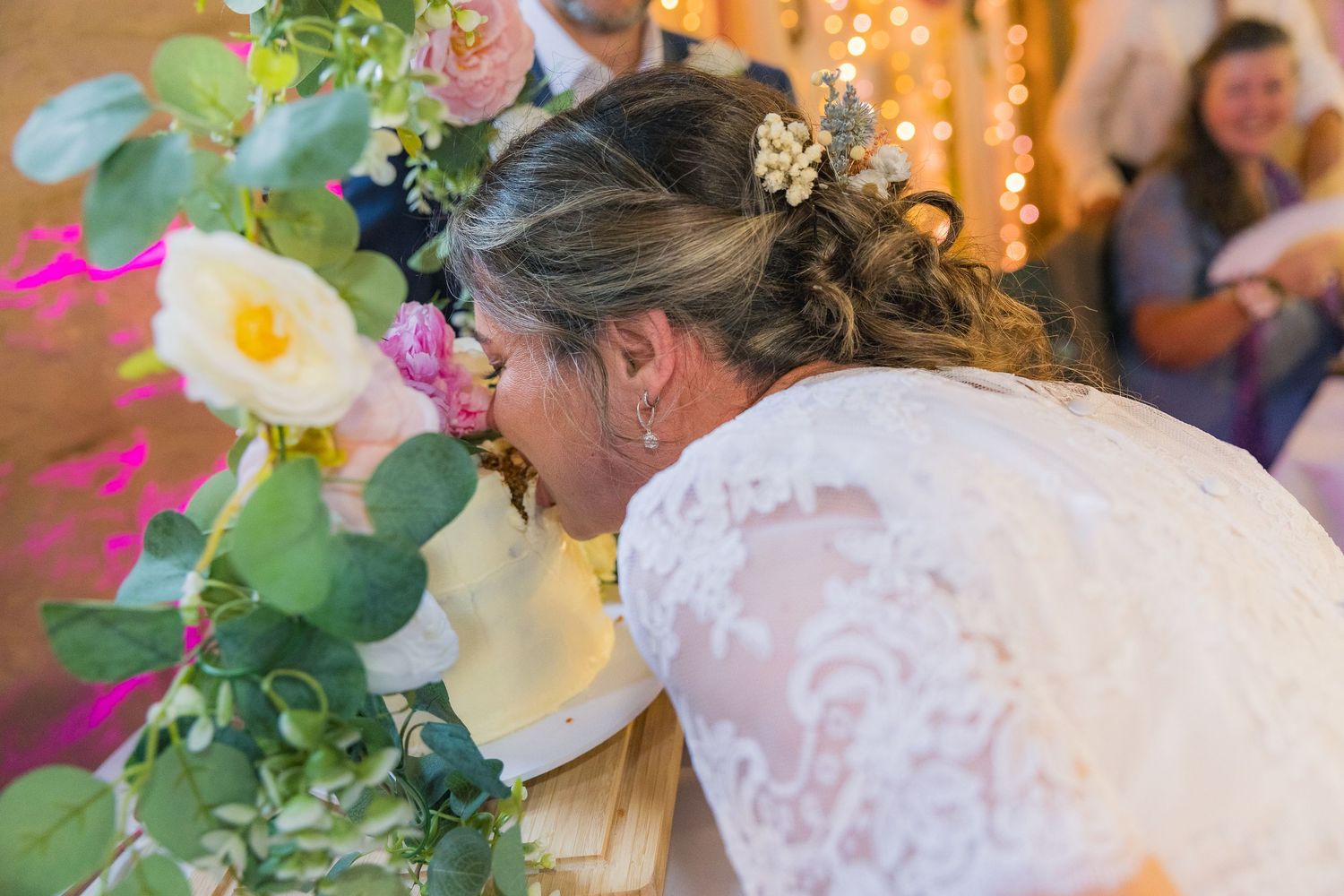 Wedding cake cutting ceremony captured by R&S Oxfordshire Photographers, full of joy and candid emotion.