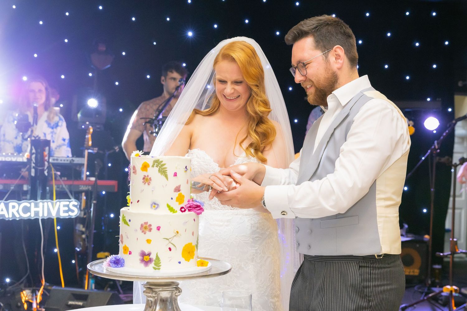 Candid shots of guests enjoying the wedding reception with laughter, toasts, and genuine moments.