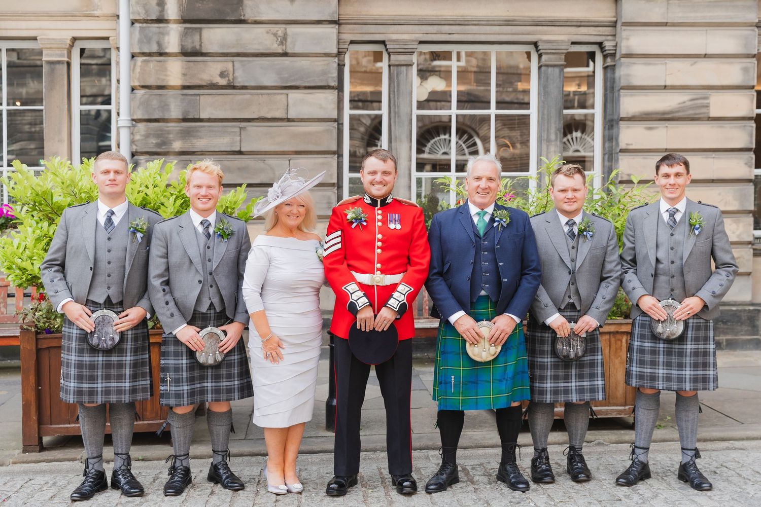 Group wedding photo with family and friends, taken by R&S Oxfordshire Photographers in a candid, relaxed style.