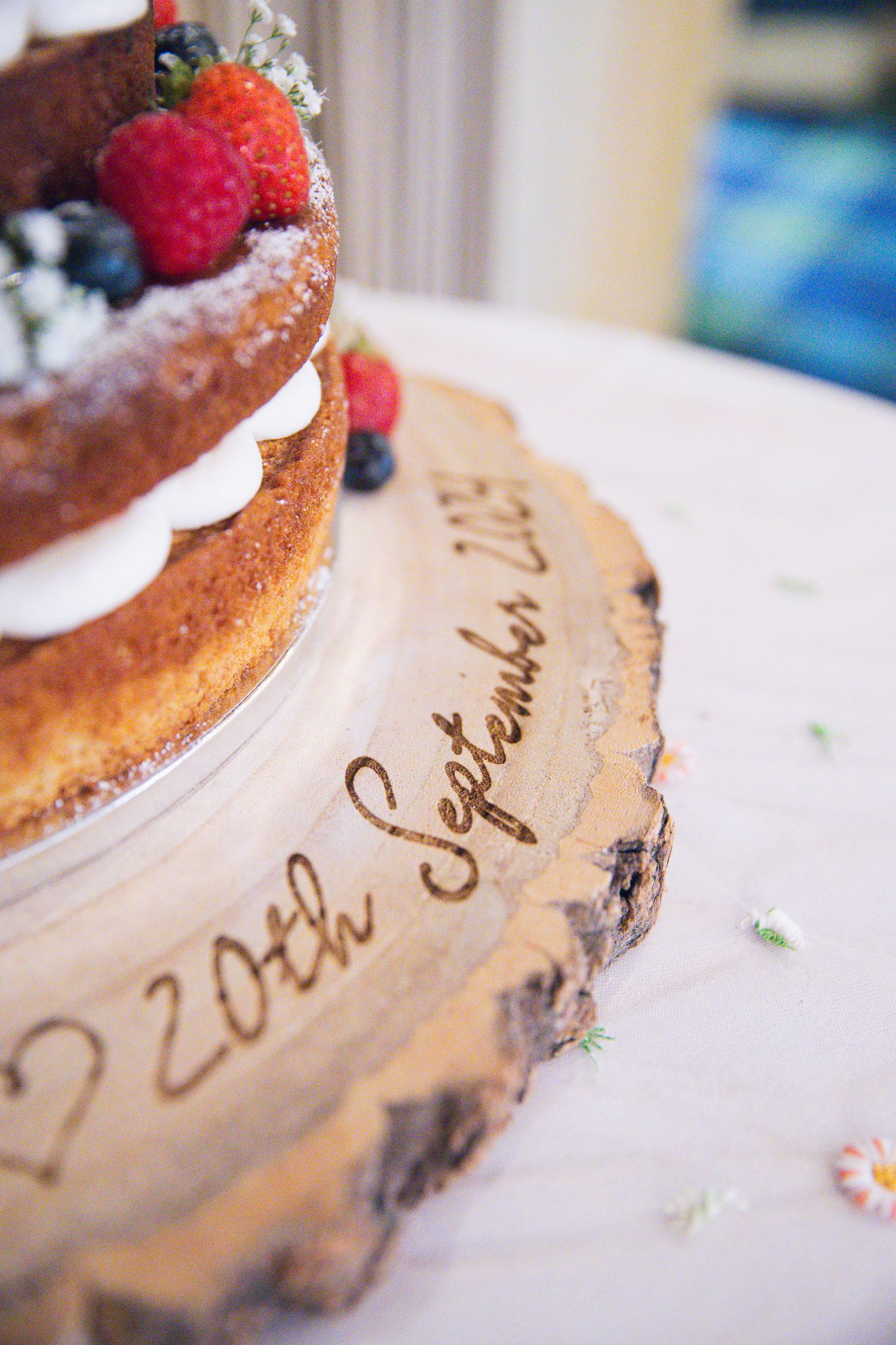 Close-up wedding details including rings, dress, flowers, and accessories, beautifully styled and lit.