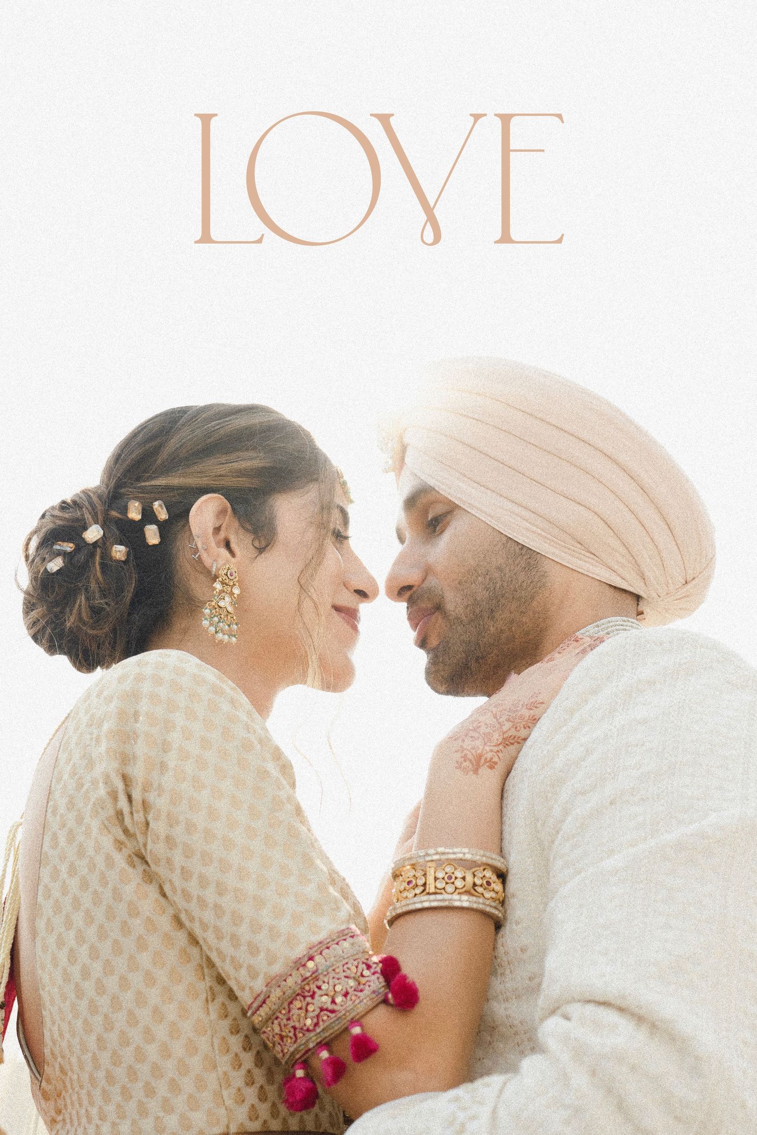 A Sikh couple in traditional attire share a romantic moment, with the word LOVE above them.