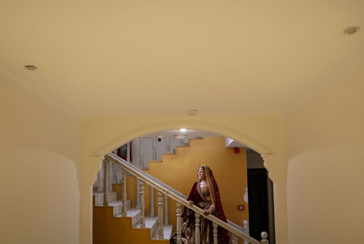 Interior staircase with warm lighting creates elegant architectural frame.