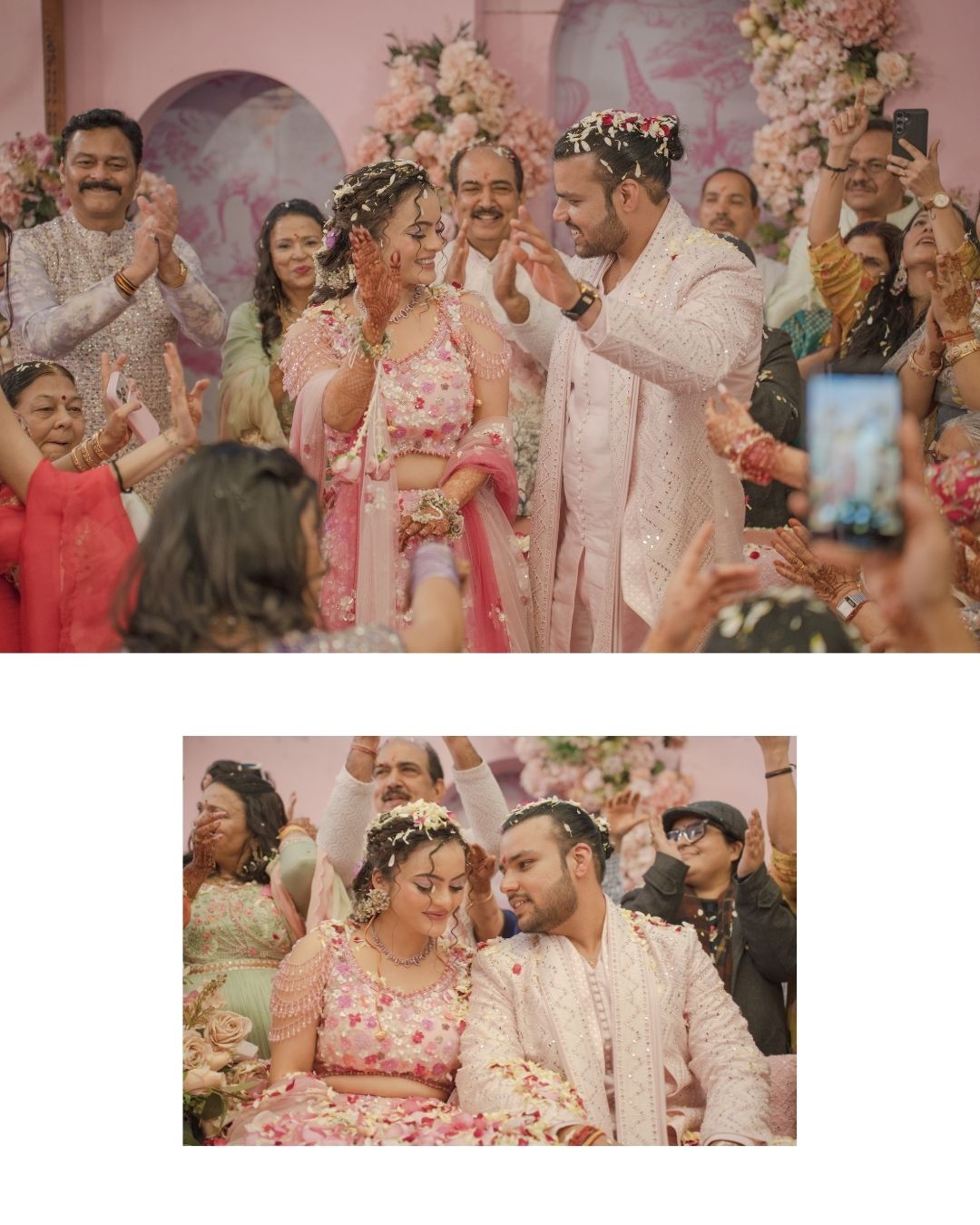Joyful Indian wedding ceremony with bride in pink lehenga and groom in white sherwani celebrating with flower petals and guests.