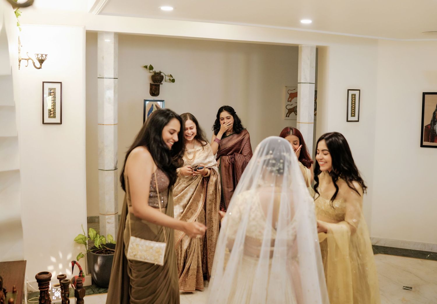 Wedding preparation scene with neutral-toned formal attire in a bright indoor setting.
