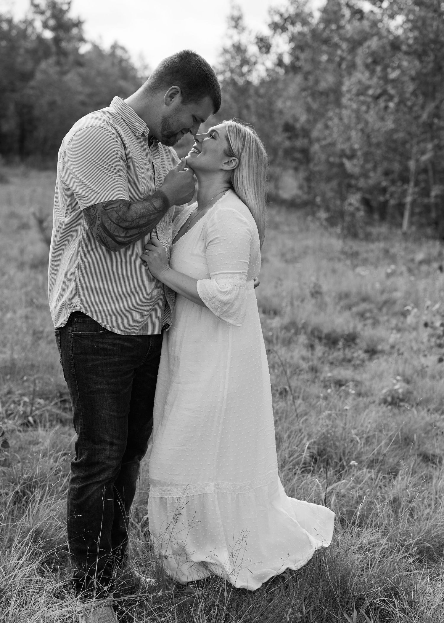 Black and white romantic couple photoshoot series in a natural outdoor setting.