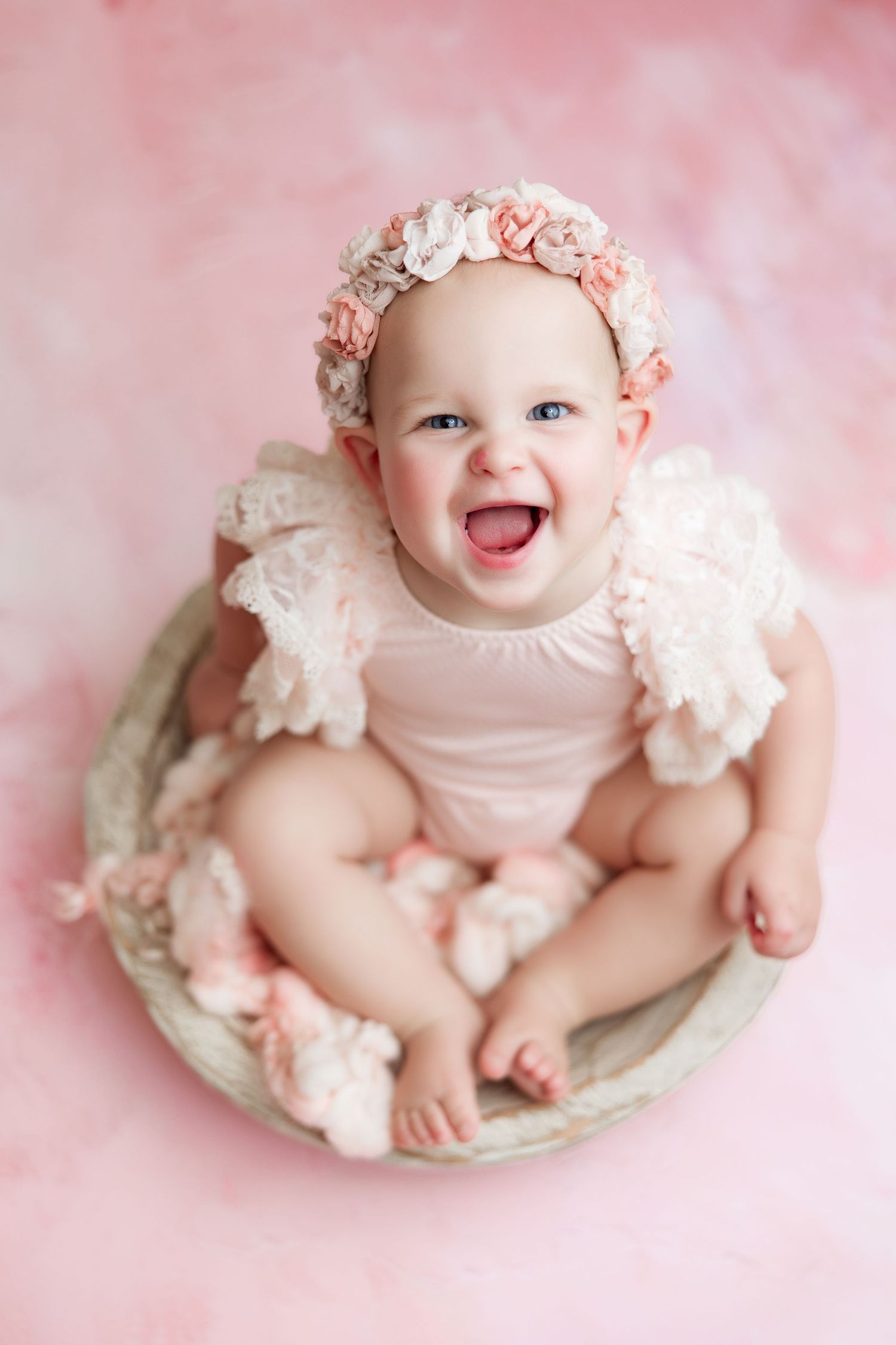 1 year old girl in pink outfit with flower crown