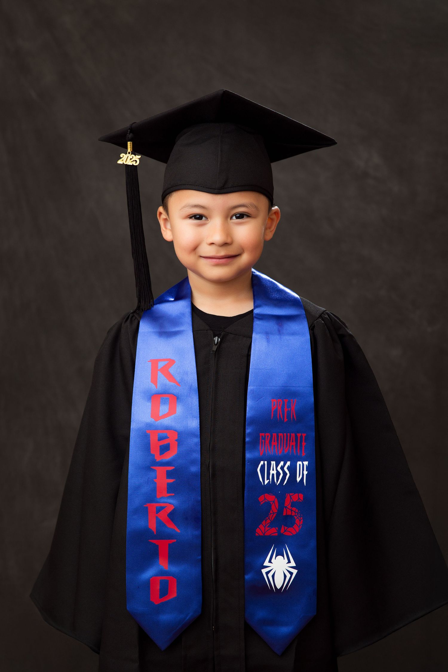 Graduation photos showing black cap and gown with custom blue and red Spider-Man themed graduation stoles.