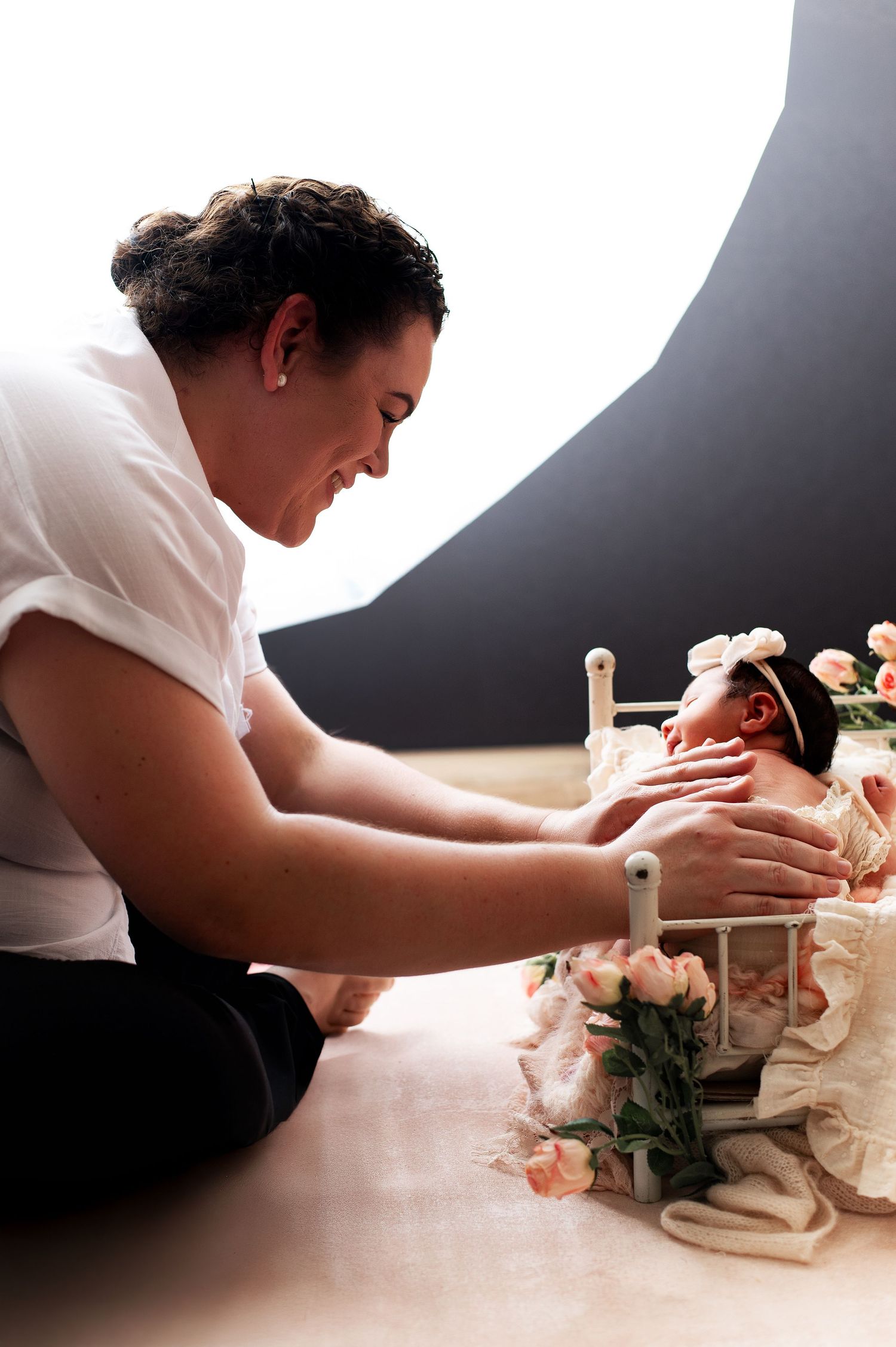 A sequence of photos showing hands carefully arranging delicate white fabric or material on a surface.