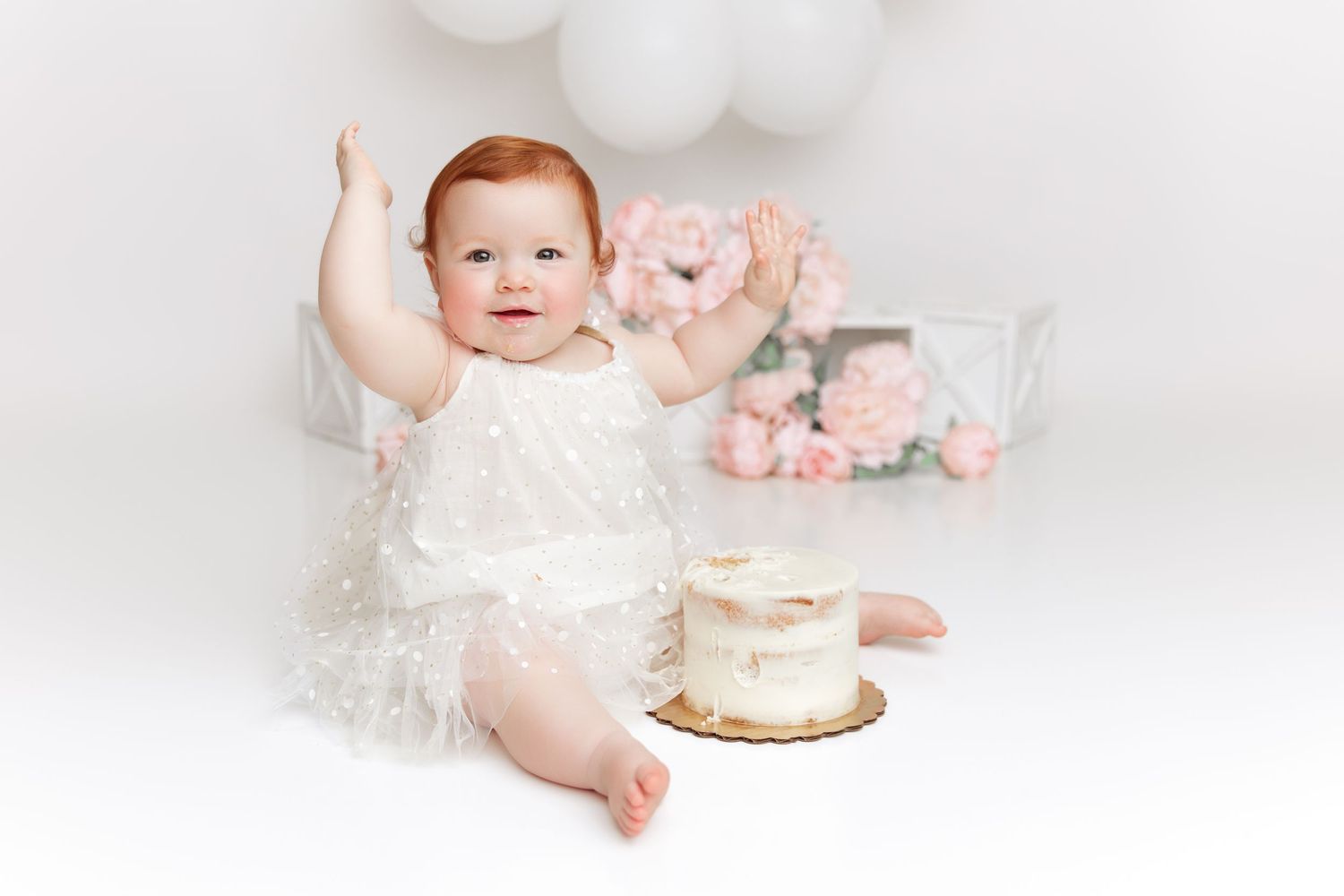 pink and white cake smash red head