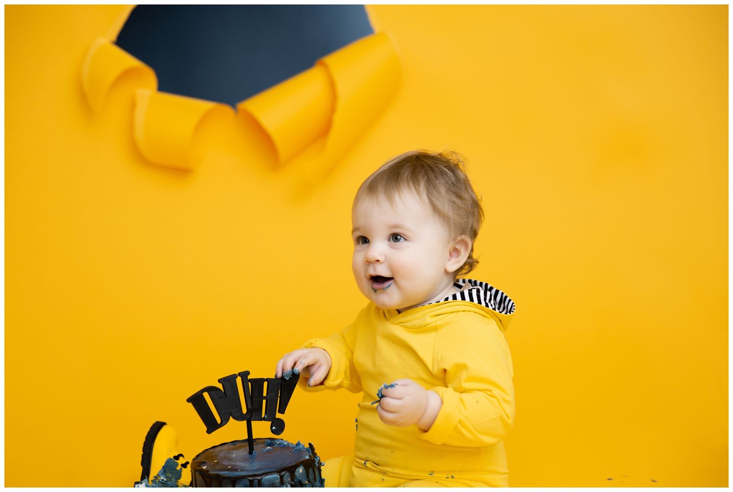 A child in a yellow sweater against a bright yellow background shows a range of playful expressions and poses.