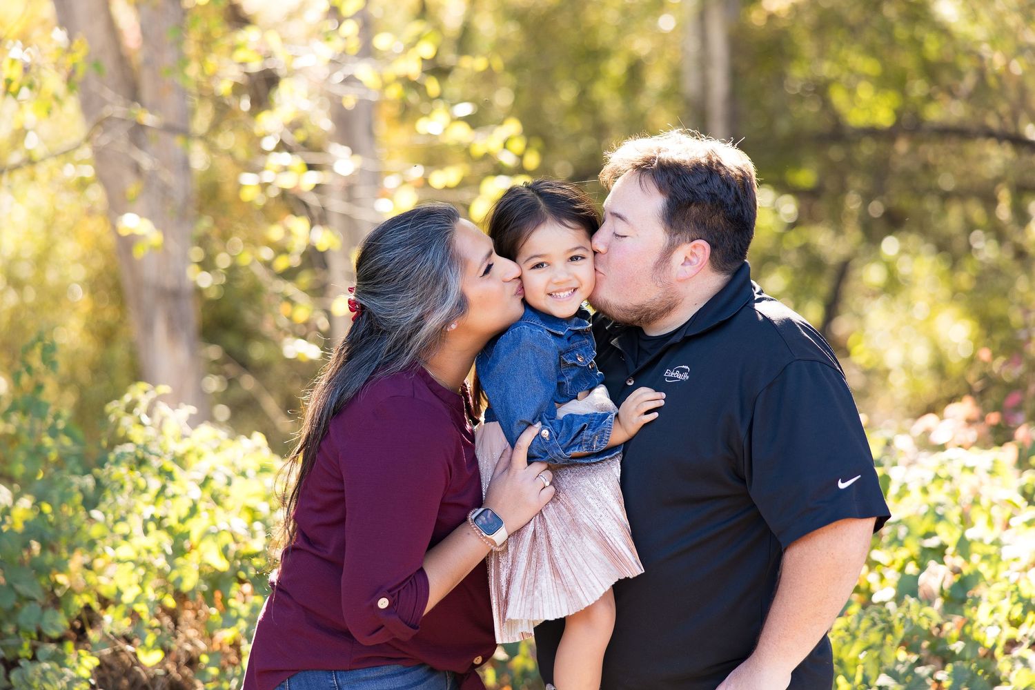 A candid series of family interactions and embraces in a natural outdoor setting.