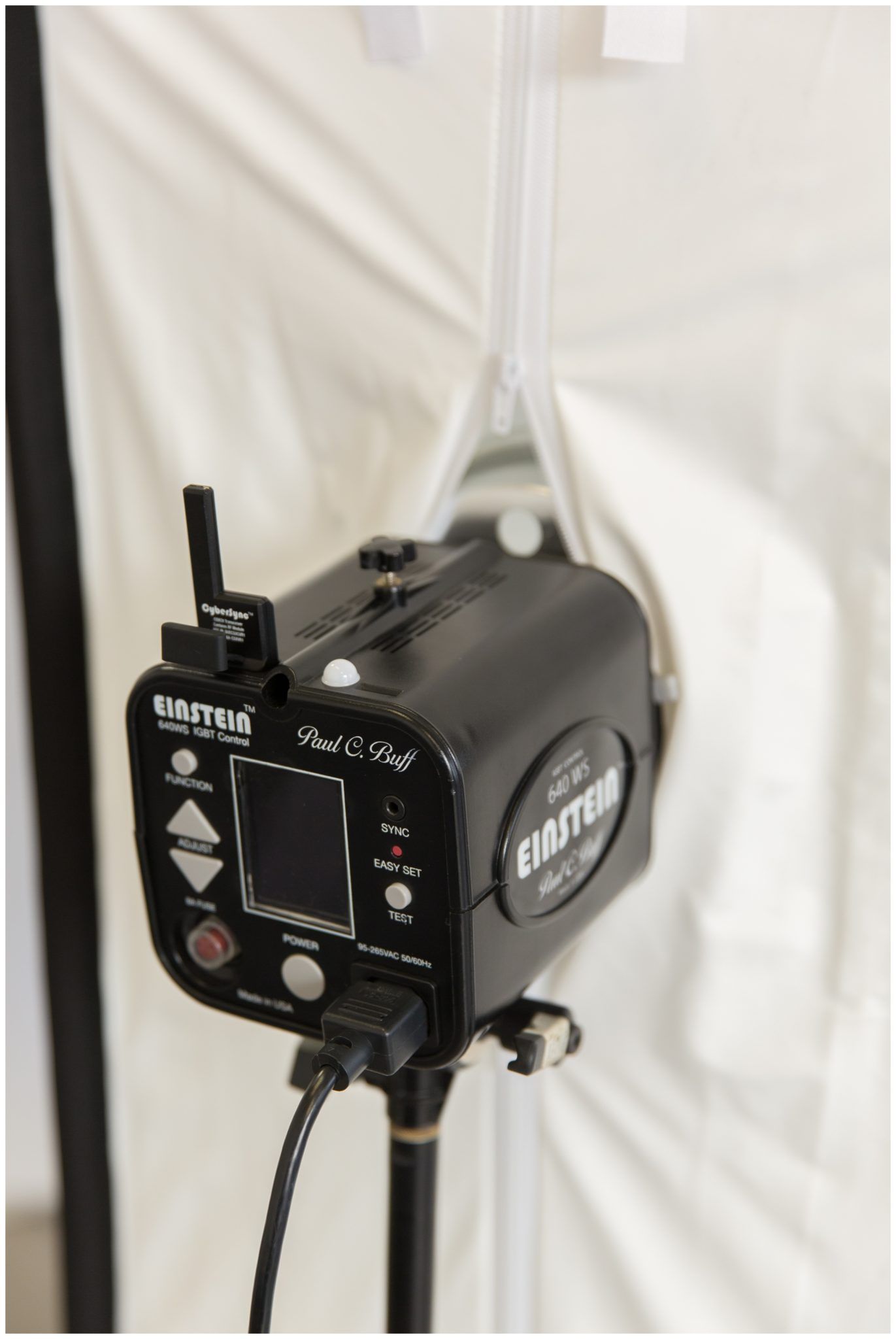 A black Chauvet DJ lighting control unit mounted on a stand against a white backdrop.