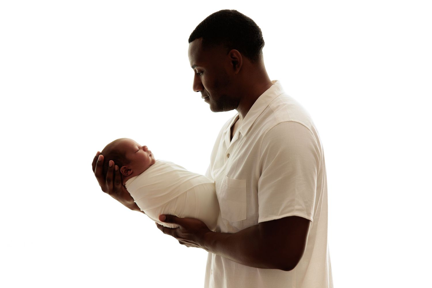 Minimalist silhouette portrait on white background showing tender family moment.