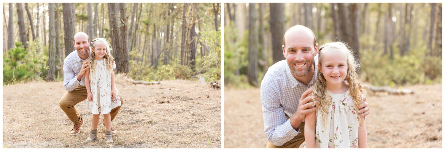A joyful family moment captured in a pine forest during a casual outdoor photo session.