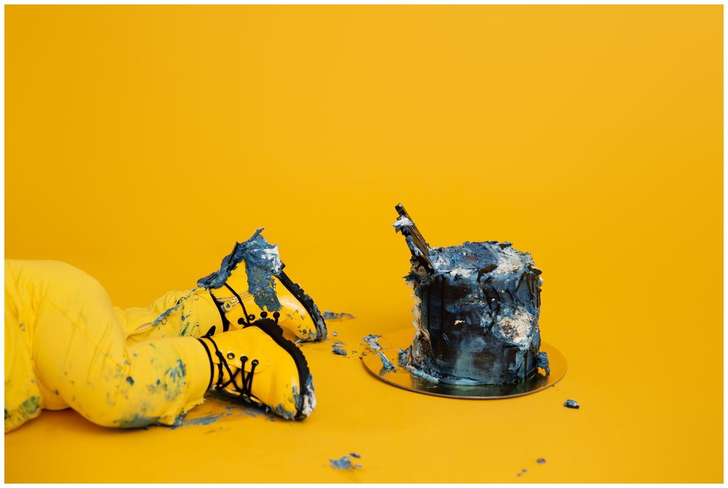 A sequence of stop motion photos showing a lemon being crushed and exploding against a bright yellow background.