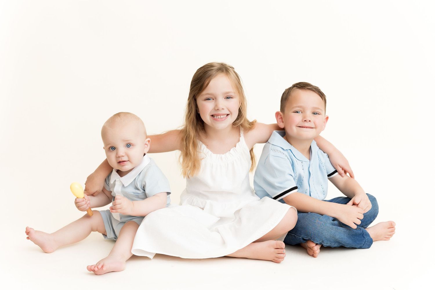 A series of crawling and playing babies in various poses creating a fun horizontal border.