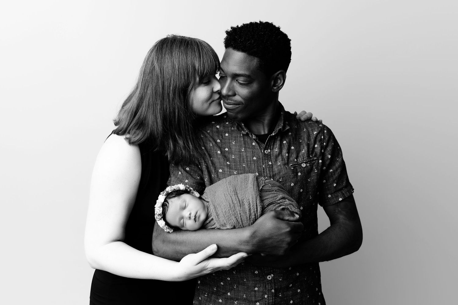 Black and white photo series showing intimate couple moments and embraces.