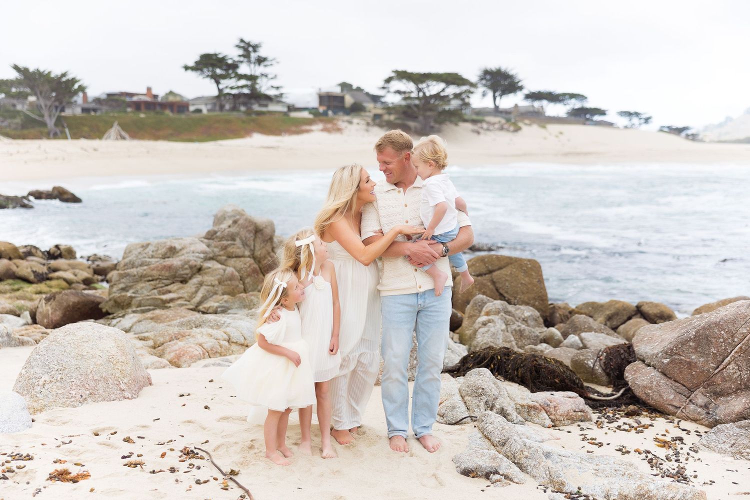 Scenic coastal beach setting with rocks and waves during a photography session.