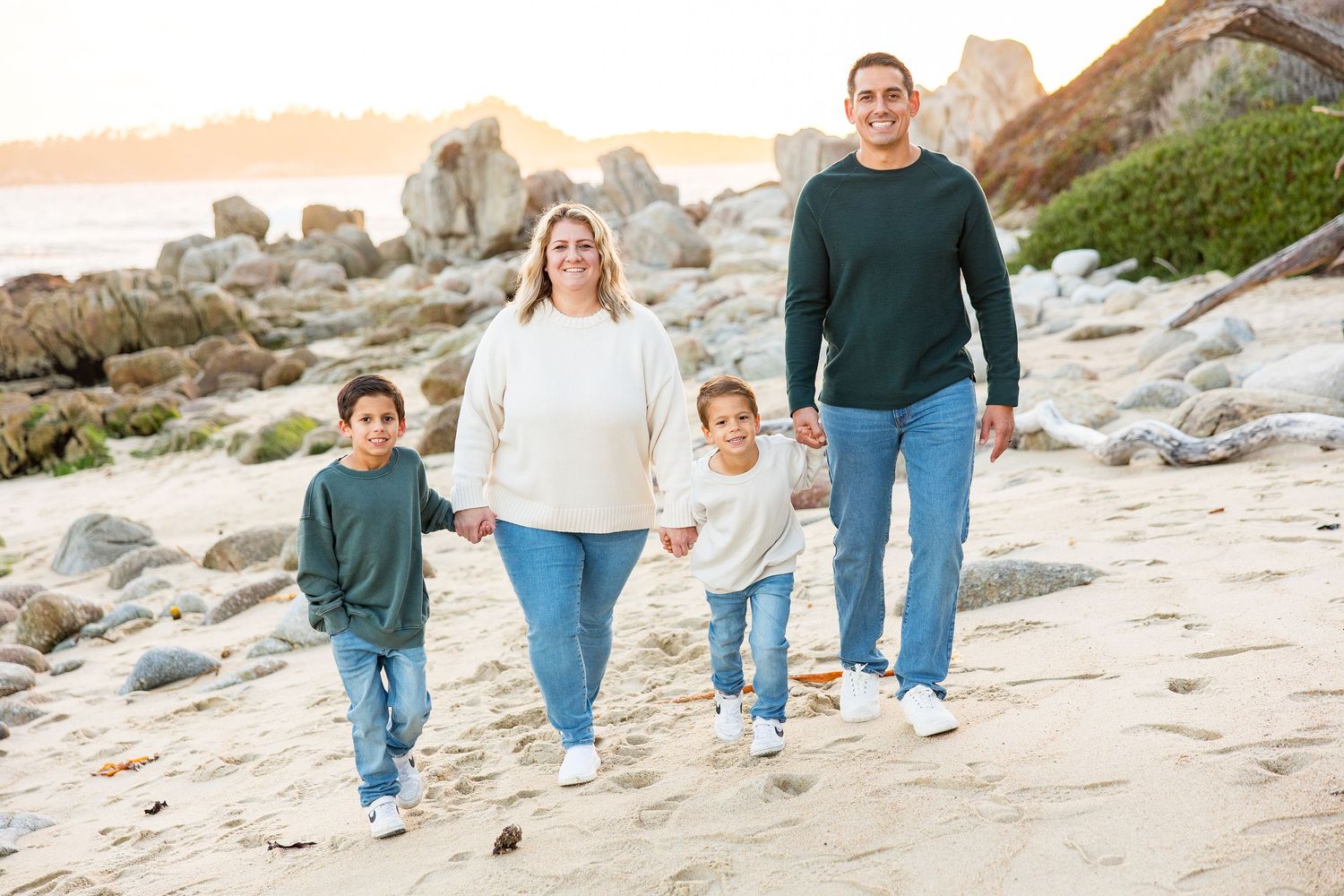 A series of candid family photos showing people walking together along a scenic rocky beach at sunset.