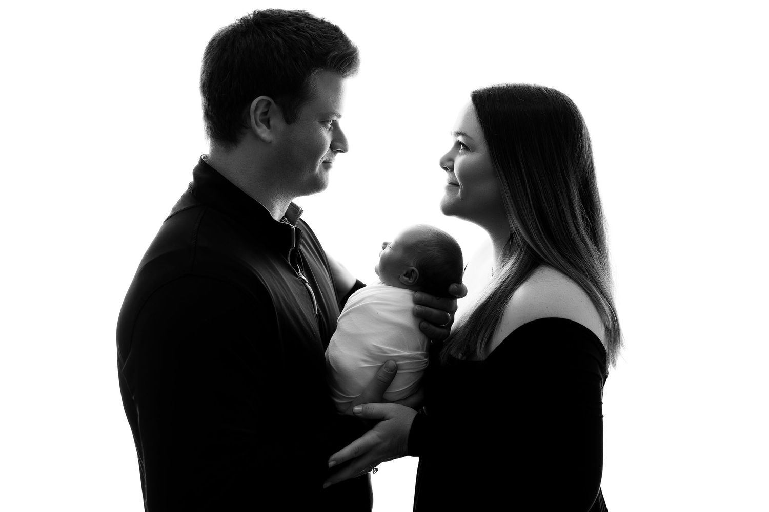 A silhouetted couple embraces in a series of romantic poses shown in multiple frames.