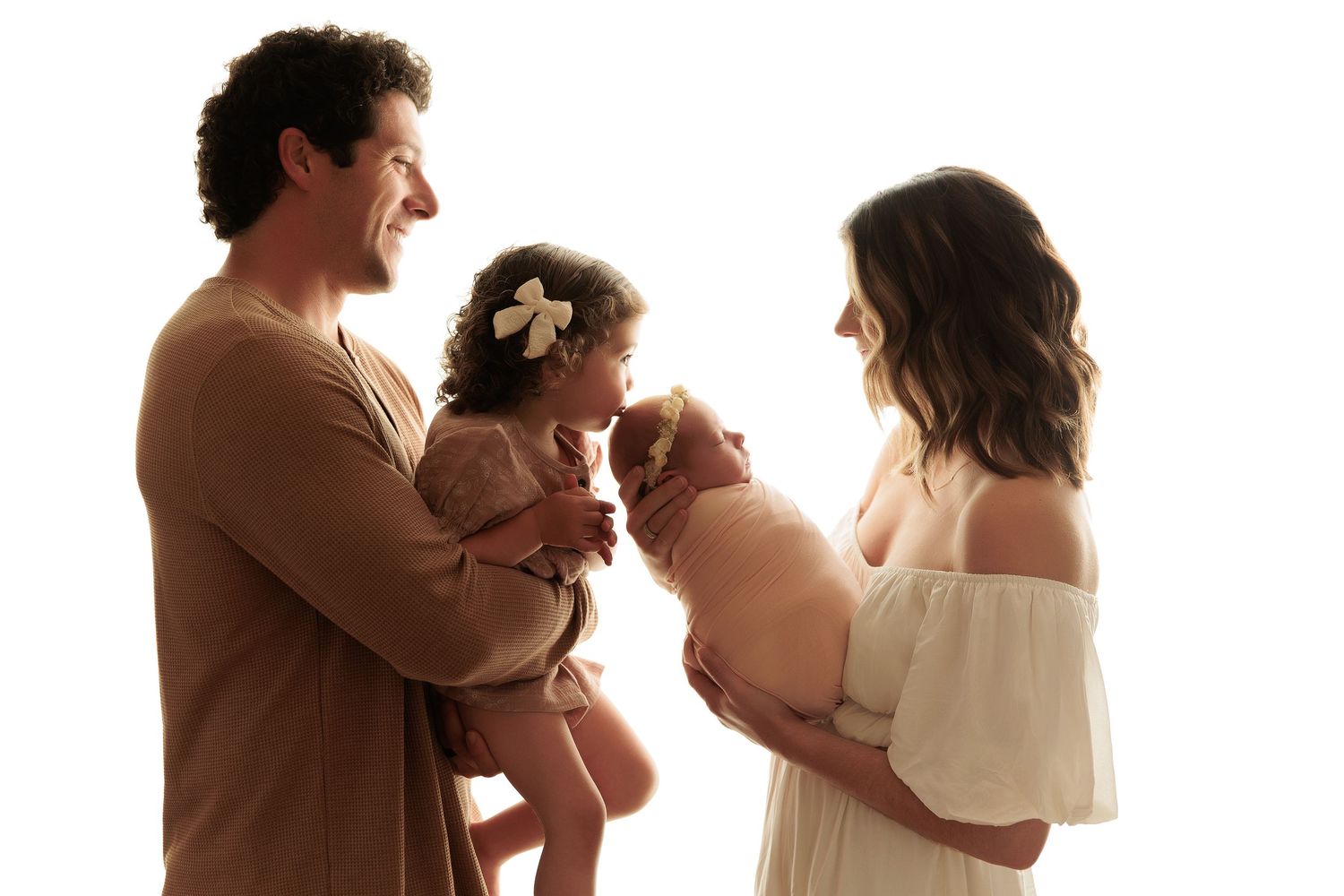 Series of artistic family portraits showing loving interactions in warm neutral tones.